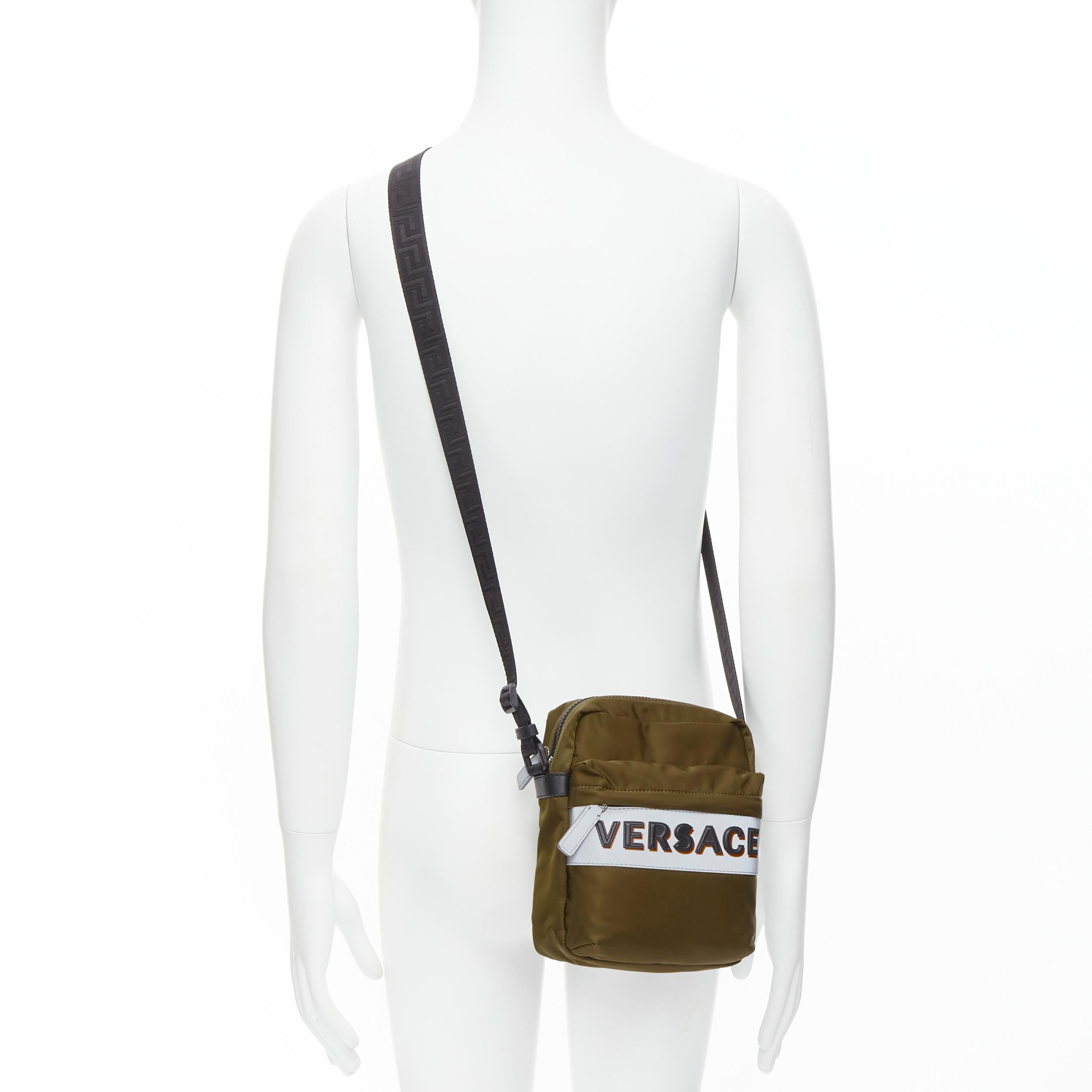 new VERSACE reflective logo green nylon Greca strap crossbody messenger bag 
Reference: TGAS/C00117 
Brand: Versace 
Designer: Donatella Versace 
Model: DL28083 DNY2R K048E 
Collection: Pre-Fall 2020 
Material: Nylon 
Color: Green 
Pattern: Solid