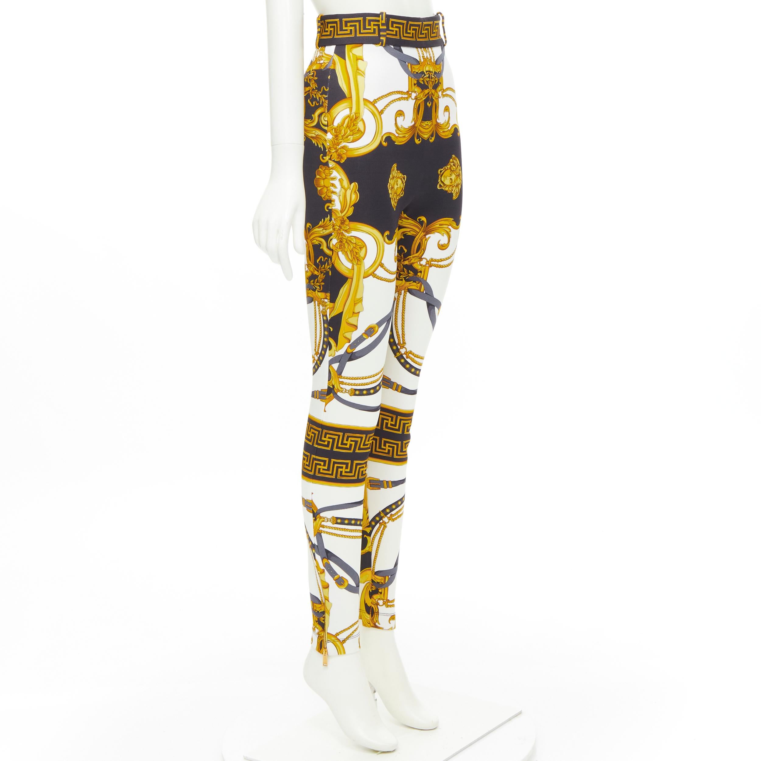new VERSACE Rodeo Barocco black gold baroque harness legging pants IT36 XXS 
Reference: TGAS/C01016 
Brand: Versace 
Designer: Donatella Versace 
Collection: Rodeo Barocco 
Material: Viscose 
Color: Gold 
Pattern: Floral 
Closure: Zip 
Extra Detail: