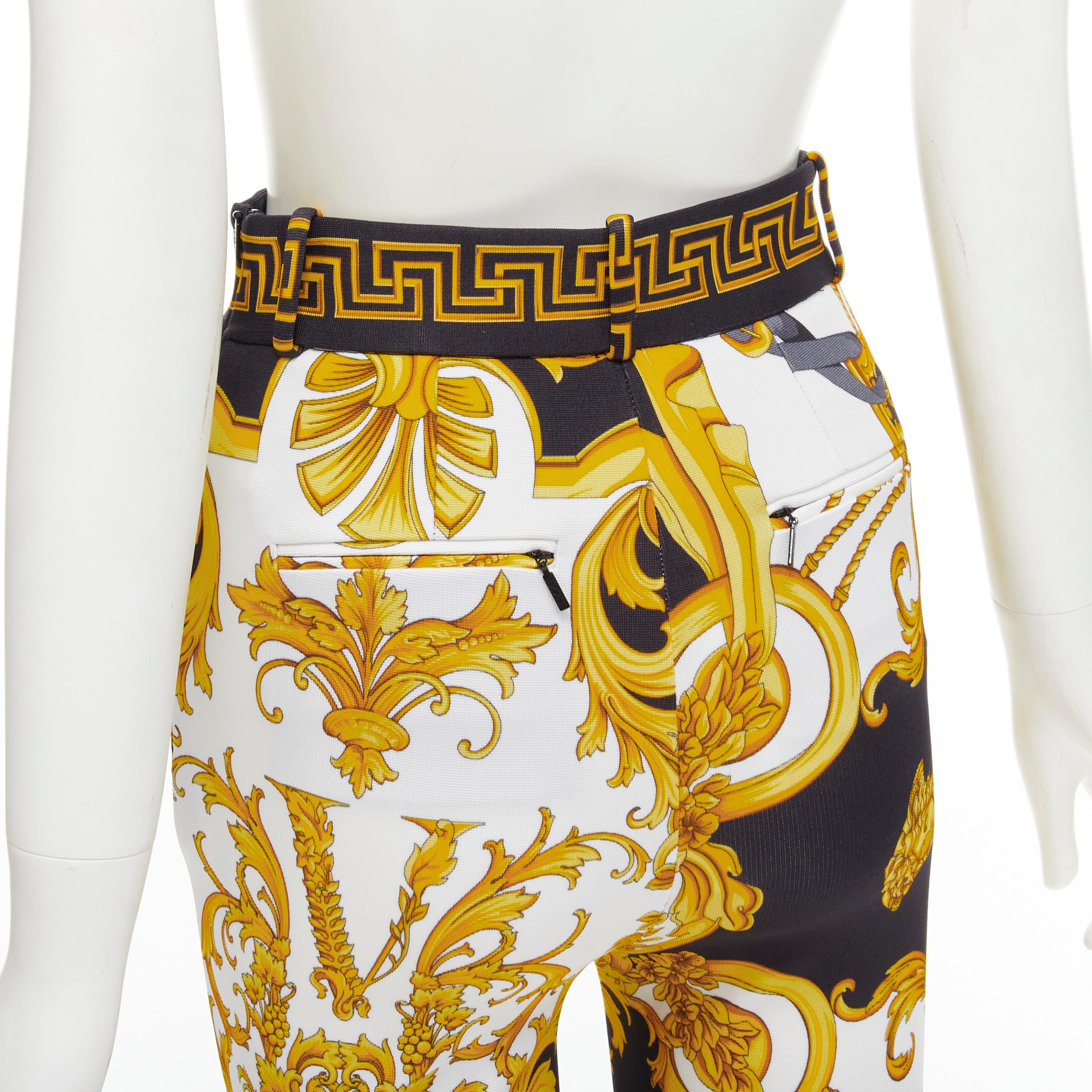new VERSACE Rodeo Barocco black gold baroque harness legging pants M IT42 
Reference: TGAS/C01023 
Brand: Versace 
Designer: Donatella Versace 
Collection: Rodeo Barocco 
Material: Viscose 
Color: Gold 
Pattern: Floral 
Closure: Zip 
Extra Detail: