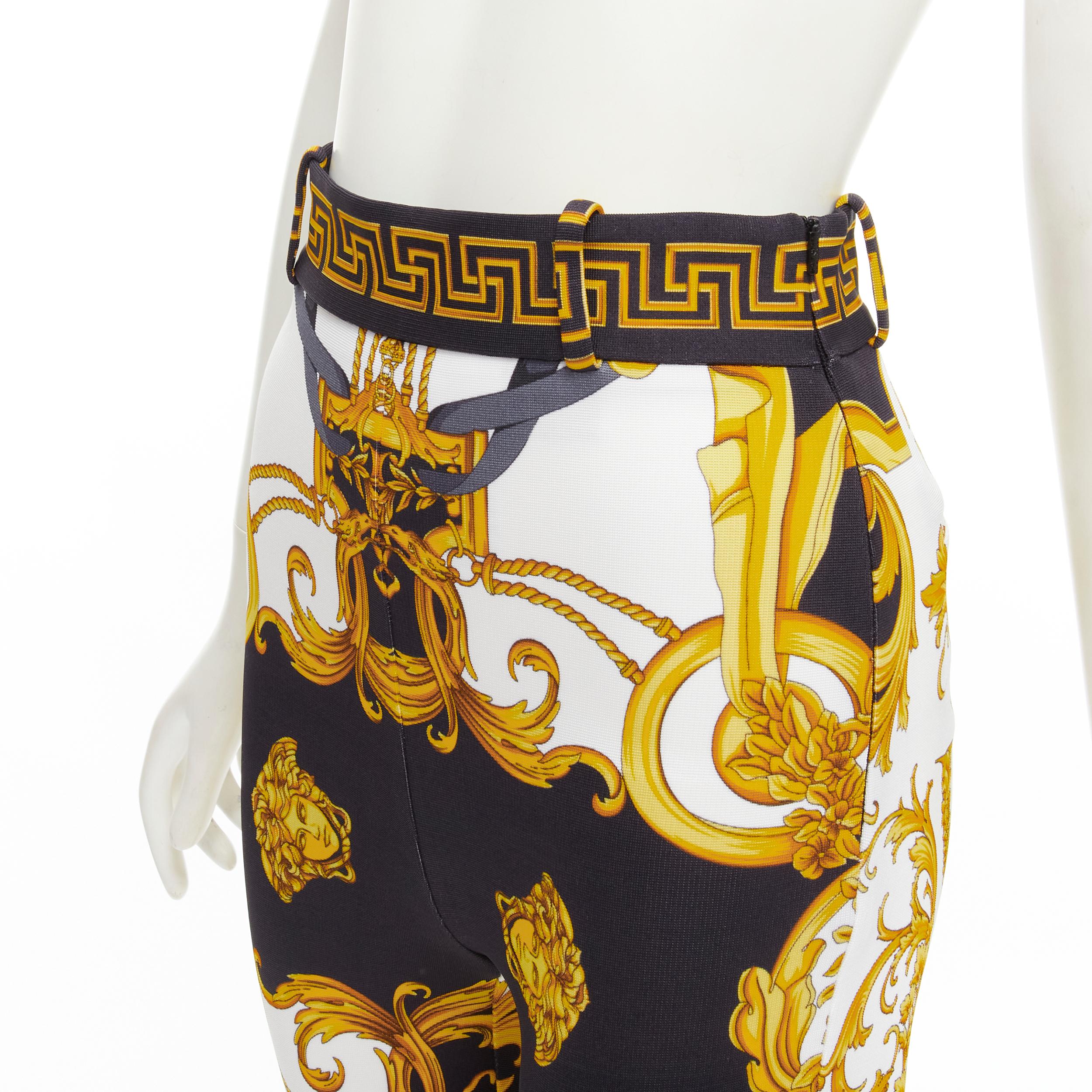 new VERSACE Rodeo Barocco black gold baroque harness print legging pants IT40 S 
Reference: TGAS/C01020 
Brand: Versace 
Designer: Donatella Versace 
Collection: Rodeo Barocco 
Material: Viscose 
Color: Gold 
Pattern: Floral 
Closure: Zip 
Extra