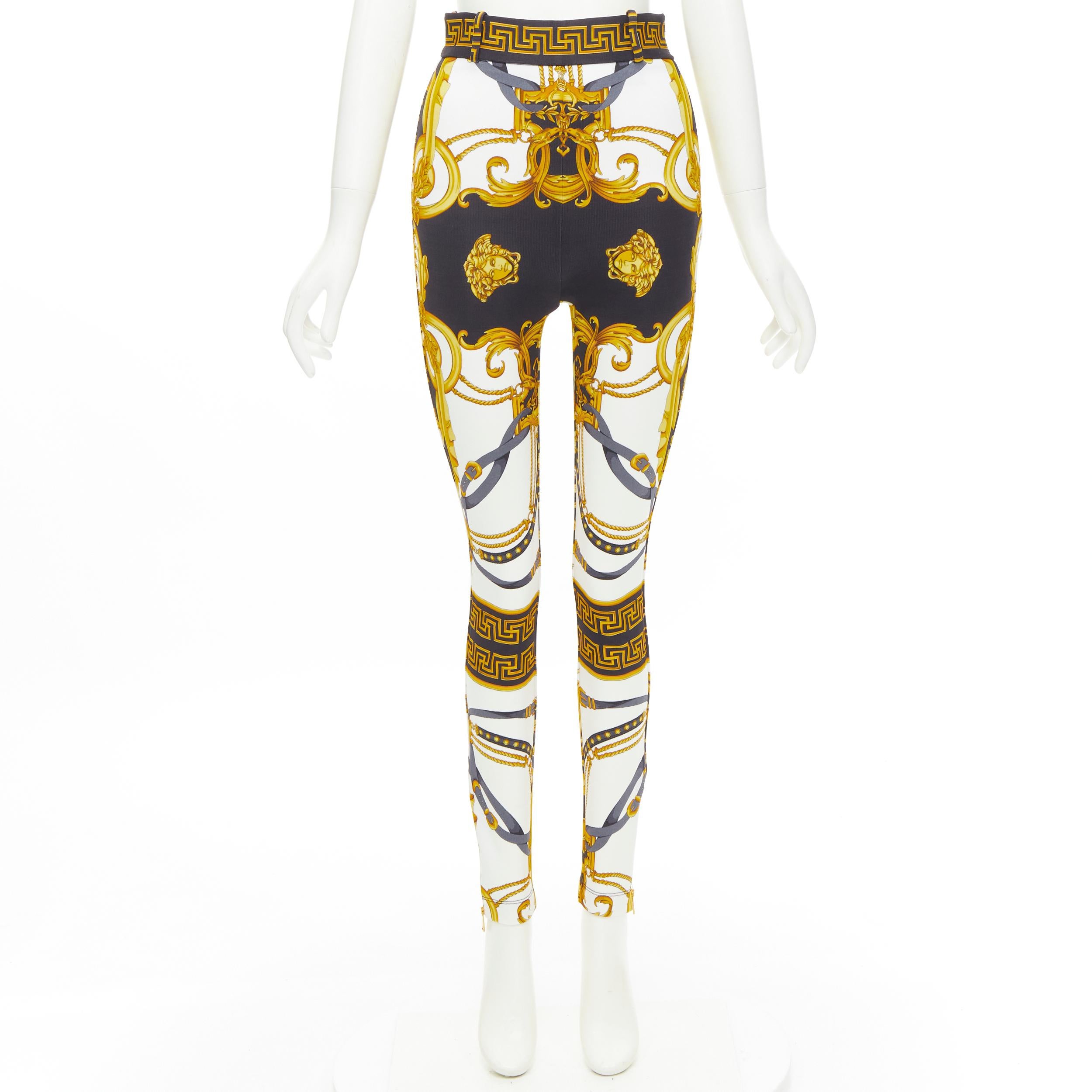 new VERSACE Rodeo Barocco black gold baroque harness print stretch pants IT38 XS 
Reference: TGAS/C01019 
Brand: Versace 
Designer: Donatella Versace 
Collection: Rodeo Barocco 
Material: Viscose 
Color: Gold 
Pattern: Floral 
Closure: Zip 
Extra
