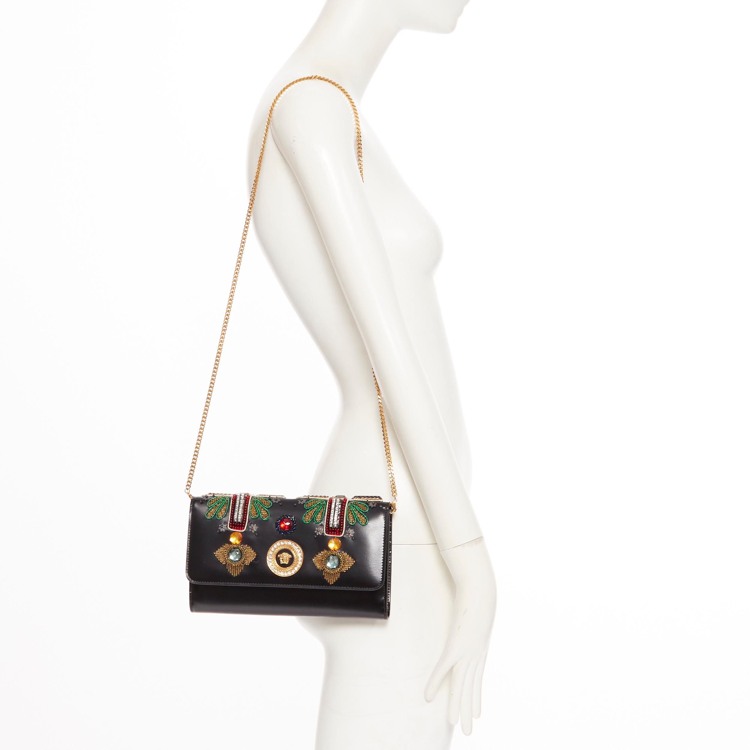 new VERSACE Runway black leather Byzantium Cross embellished wallet on chain bag
Brand: Versace
Designer: Donatella Versace
Collection: Spring Summer 2018
Model Name / Style: Byzantine Cross clutch
Material: Leather; calfskin leather
Color: Black;