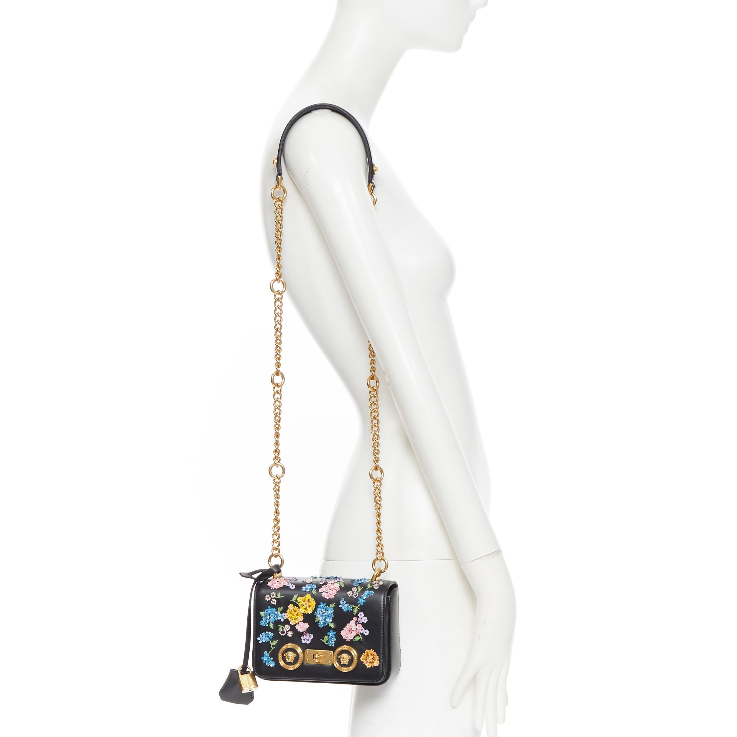 new VERSACE Runway Mini Icon black floral embellished Medusa small shoulder bag
Brand: Versace
Designer: Donatella Versace
Collection: 2019
Model Name / Style: Mini Icon
Material: Leather
Color: Black
Pattern: Floral
Closure: Turnlock
Lining