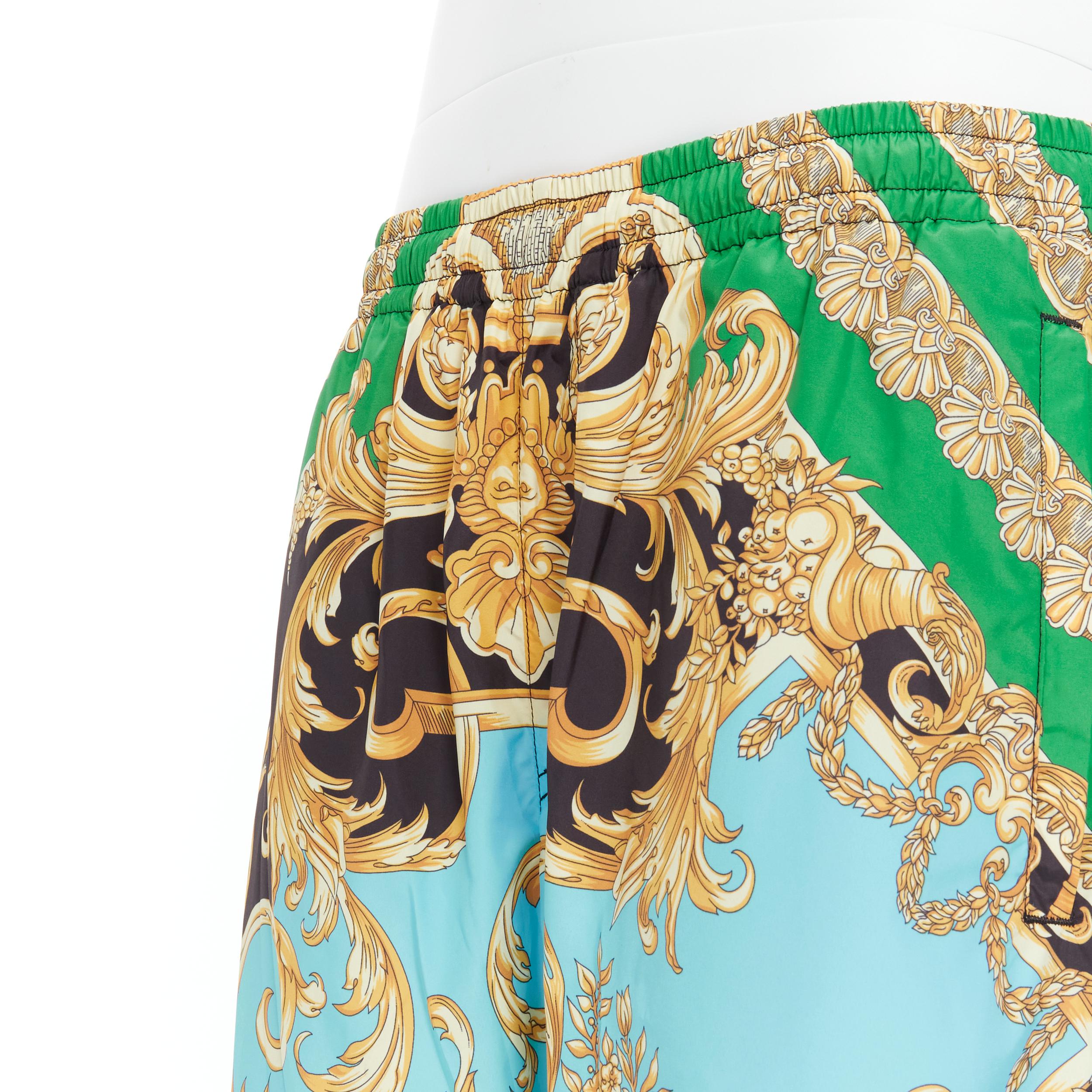 new VERSACE Runway Statue Barocco green blue baroque nylon track pants IT52 XL 
Reference: TGAS/B01489 
Brand: Versace 
Designer: Donatella Versace 
Material: Nylon 
Color: Green 
Pattern: Floral 
Closure: Elastic 
Extra Detail: 1990's track pants.
