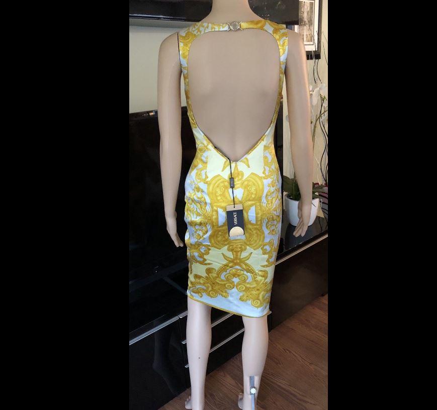 NWT Versace S/S 2005 Runway Cutout Open Back Dress IT 38

Look 13 from the Spring 2005 Runway. Versace sleeveless knee-length dress with signature Versace print throughout, scoop neck, open back featuring medusa clasp closure at nape and concealed