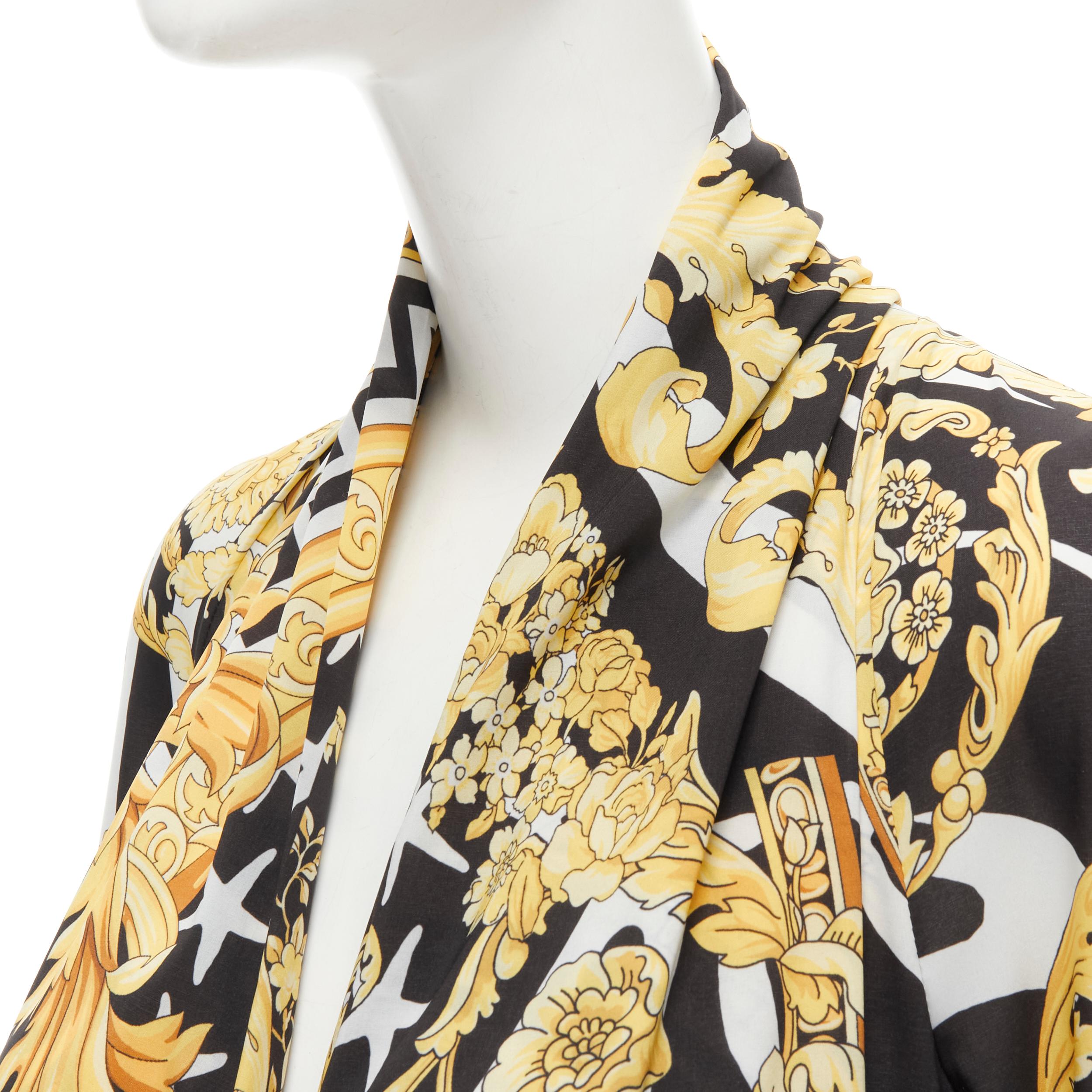 new VERSACE Savage Barocco black gold plunge neck bodysuit top IT38 XS 
Reference: TGAS/B01864 
Brand: Versace 
Designer: Donatella Versace 
Material: Polyester 
Color: Gold 
Pattern: Floral 
Closure: Button 
Extra Detail: Savage Barocco print.