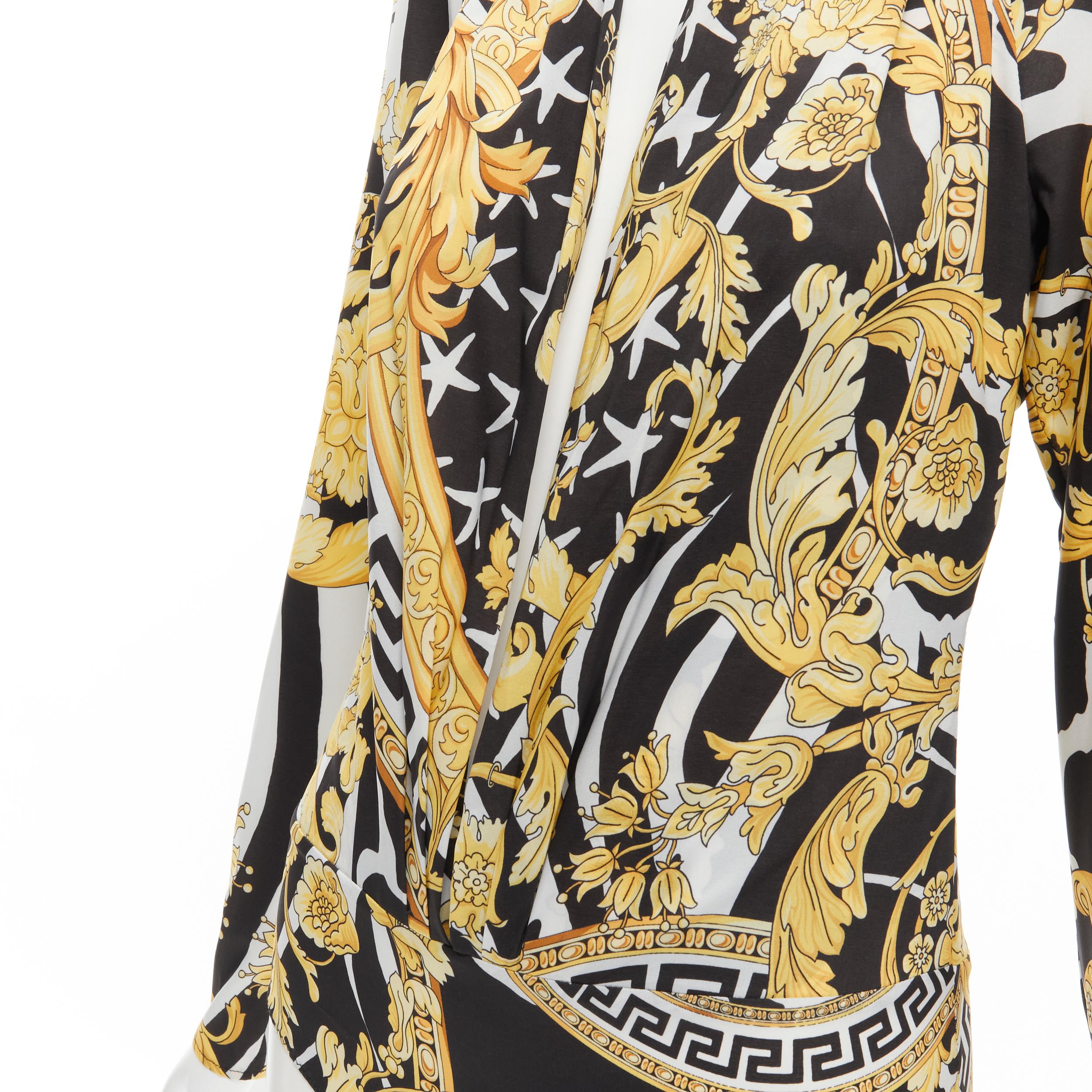 new VERSACE Savage Barocco black gold plunge neck long sleeve body top IT40 S 
Reference: TGAS/C00880 
Brand: Versace 
Designer: Donatella Versace 
Collection: Savage Barocco 
Material: Polyester 
Color: Gold 
Pattern: Floral 
Closure: Button 
Extra