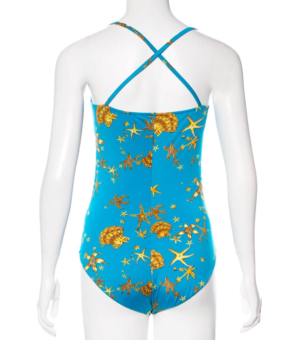 New Versace Women's One-piece Swimsuit
Designer size 2 - US size S
One-Piece Swimsuit with Yellow/Brown Starfish and Sea Shell Print Throughout Over the Beautiful Turquoise Background, Interior Padding at Bust and Crossover Straps at Back, Fully