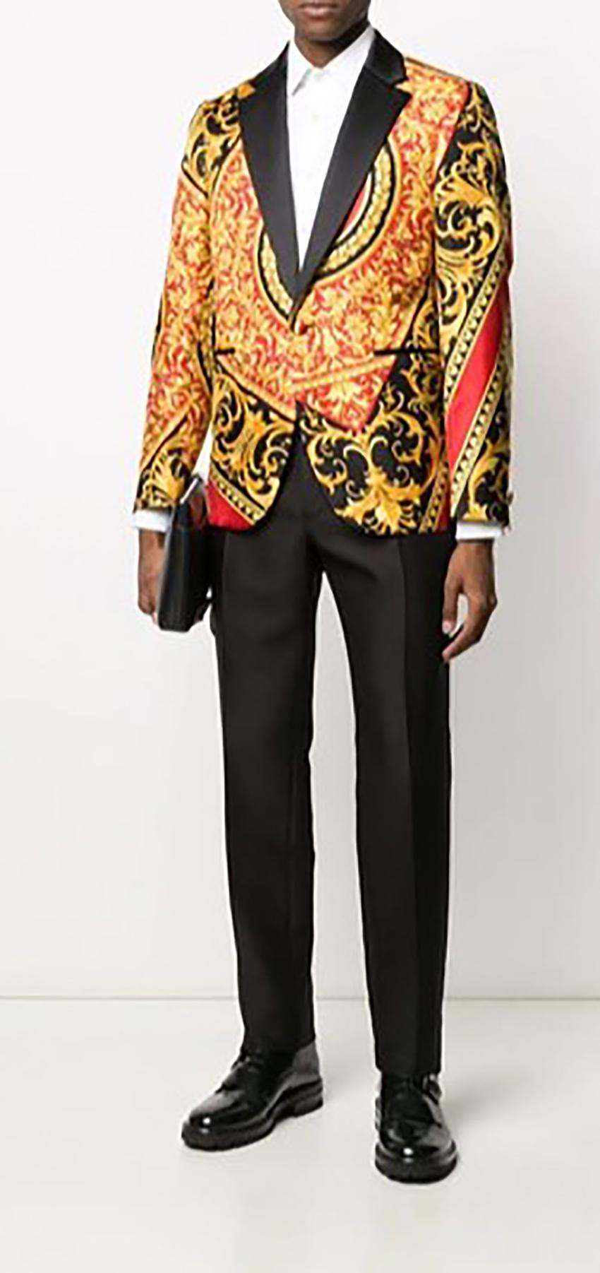 VERSACE  

Stand-out from the crowd in this eye-catching Baroque print blazer from Versace. 

Crafted in cotton and silk, this red and black blazer is emblazoned with the House's signature gold-tone Baroque baroque print.

 Embrace ornate style.