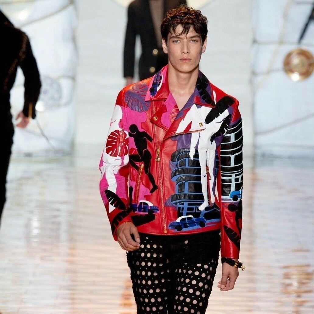 new VERSACE SS15 Cuba red abstract print 100% silk gold medusa button shirt XS
VERSACE MAINLINE
From the Spring Summer 2015 Collection
Versace Cuba Print. 
Red and purple based. 
Abstract men, palm leaf, vintage car silhouette shapes.