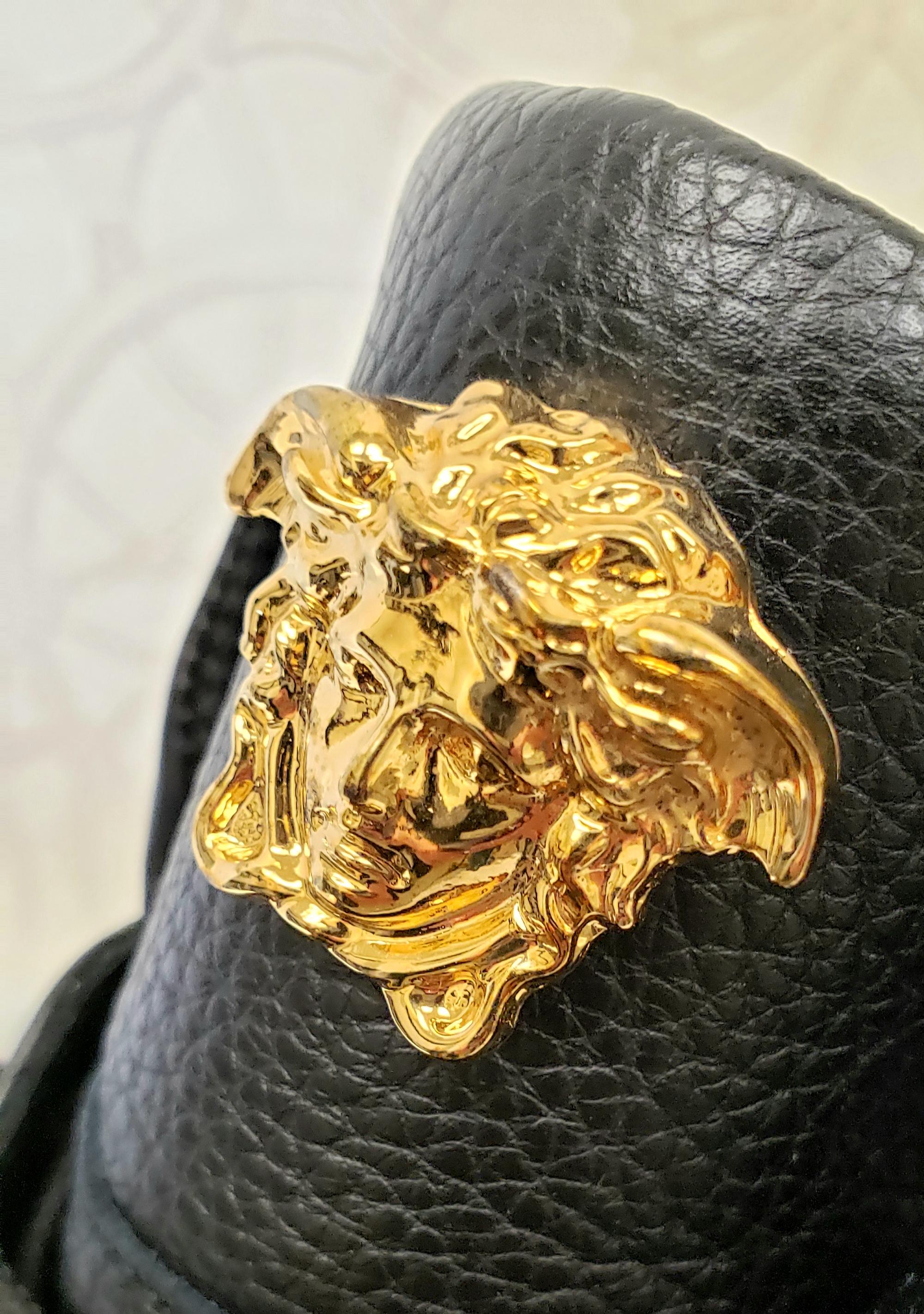 VERSACE 



VERSACE STUDDED HIGH-TOP SNEAKERS with GOLD MEDUSA BUCKLE 
  
This shoe is embodied in true Versace-style and  features a great mix of black smooth leathers with gold-tone accents.  
Gold-tone 3 D Medusa complement the black leather