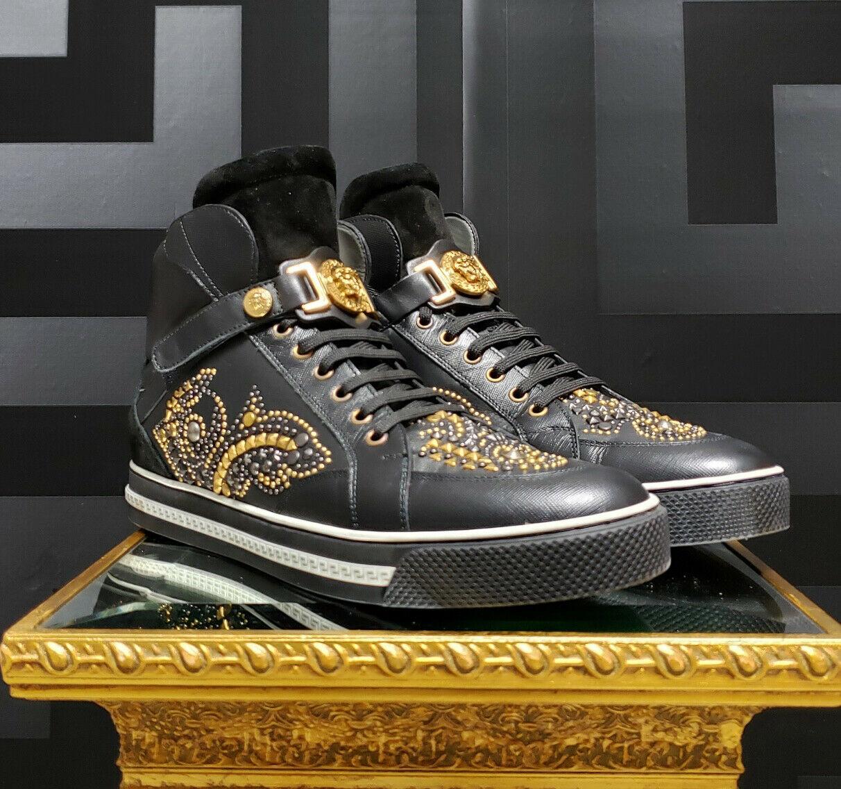 NEW VERSACE STUDDED HIGH-TOP SNEAKERS with GOLD MEDUSA BUCKLE 
  
This shoe is embodied in true Versace-style and  features a great mix of black suede and smooth leathers with gold-tone accents.  
Gold-tone studs complement the black silhouette on