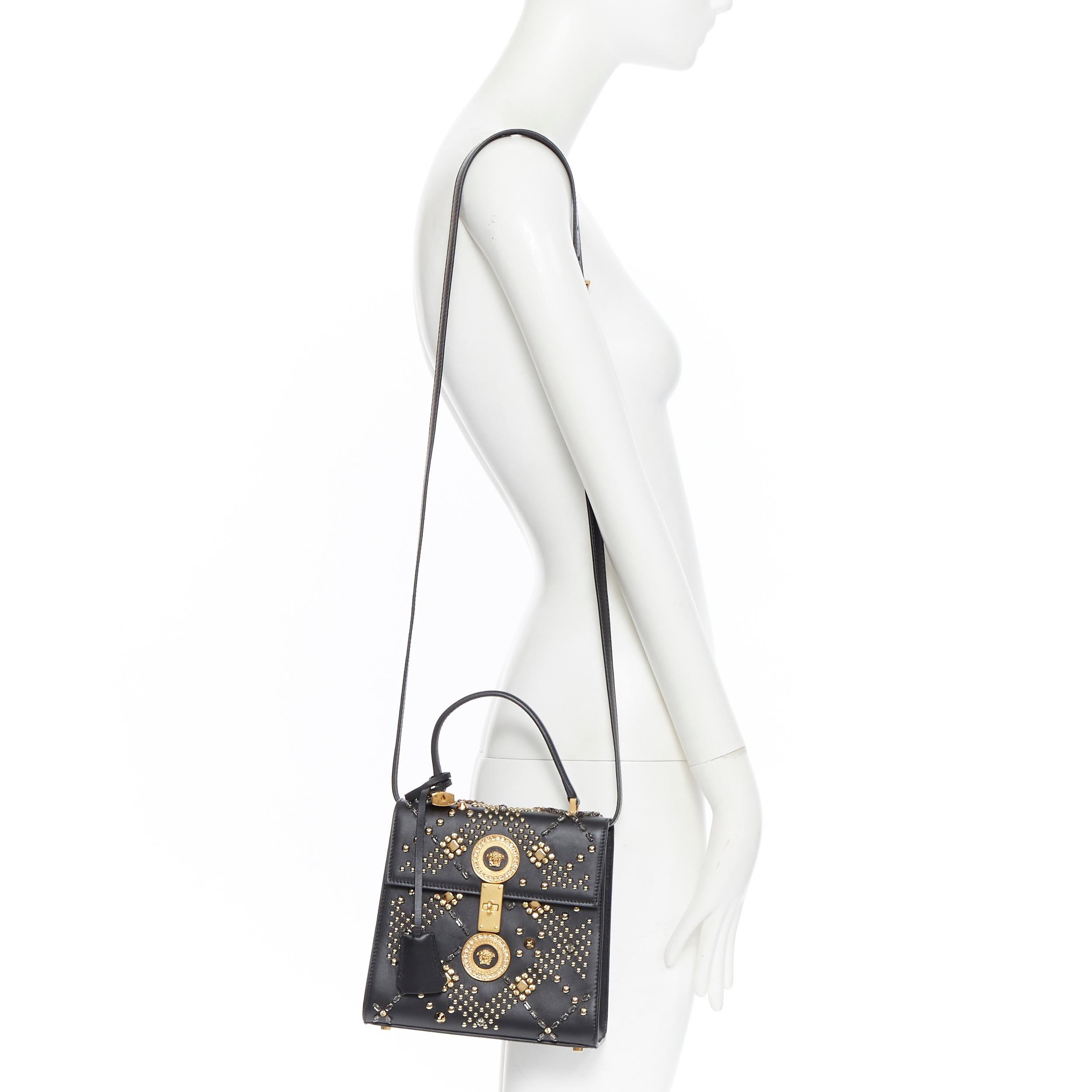new VERSACE Tribute Icon 1993 black calfskin crystal stud Medusa flap kelly bag
Brand: Versace
Designer: Donatella Versace
Collection: Spring Summer 2018
Model Name / Style: Tribute bag
Material: Leather
Color: Black
Pattern: Other
Closure: