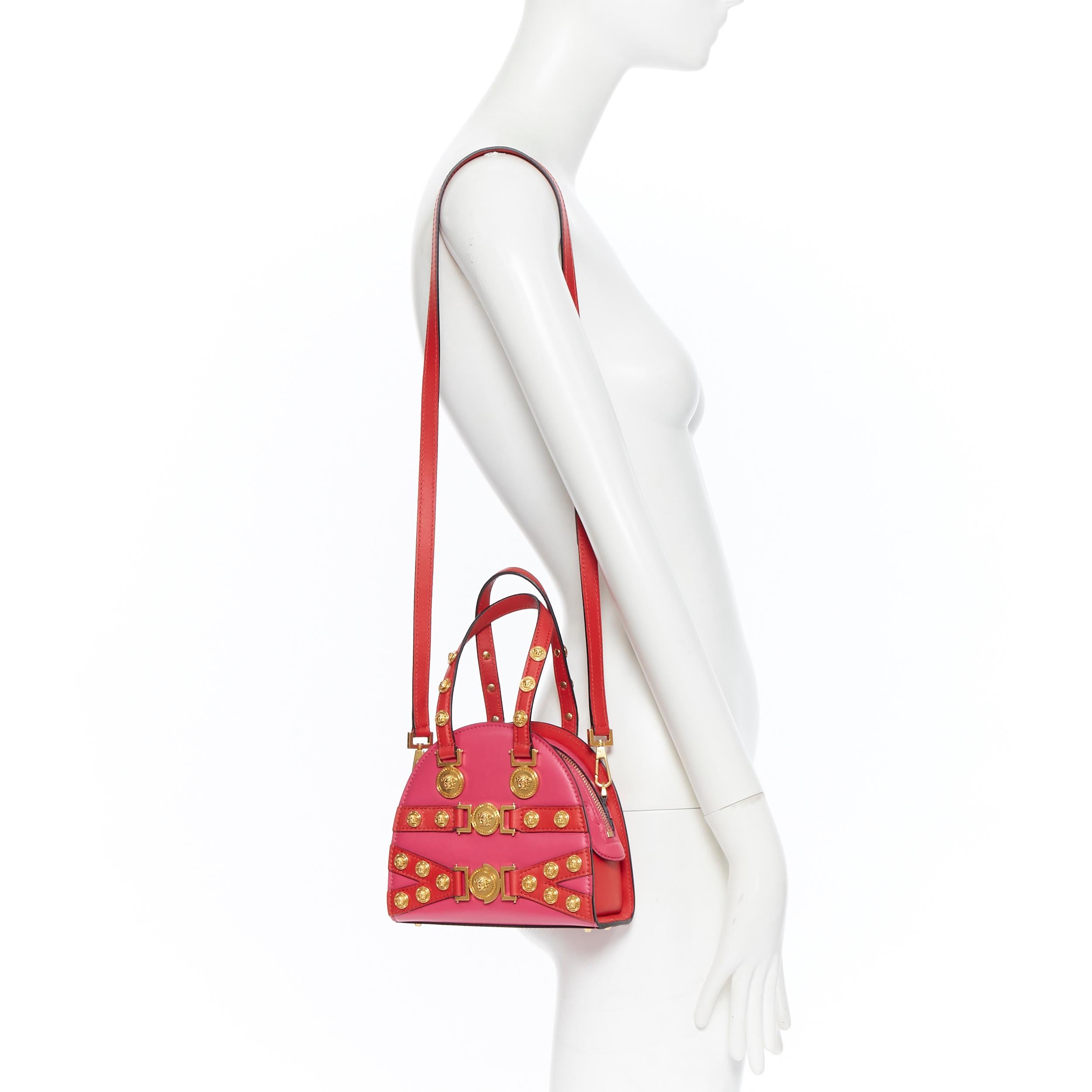 new VERSACE Tribute Medallion Small Bowling fuschia bondage Medusa stud bag Reference: TGAS/B00592 
Brand: Versace 
Designer: Donatella Versace 
Model: Tribute Bowling Crossbody 
Collection: Spring Summer 2018 
Material: Leather 
Color: Pink