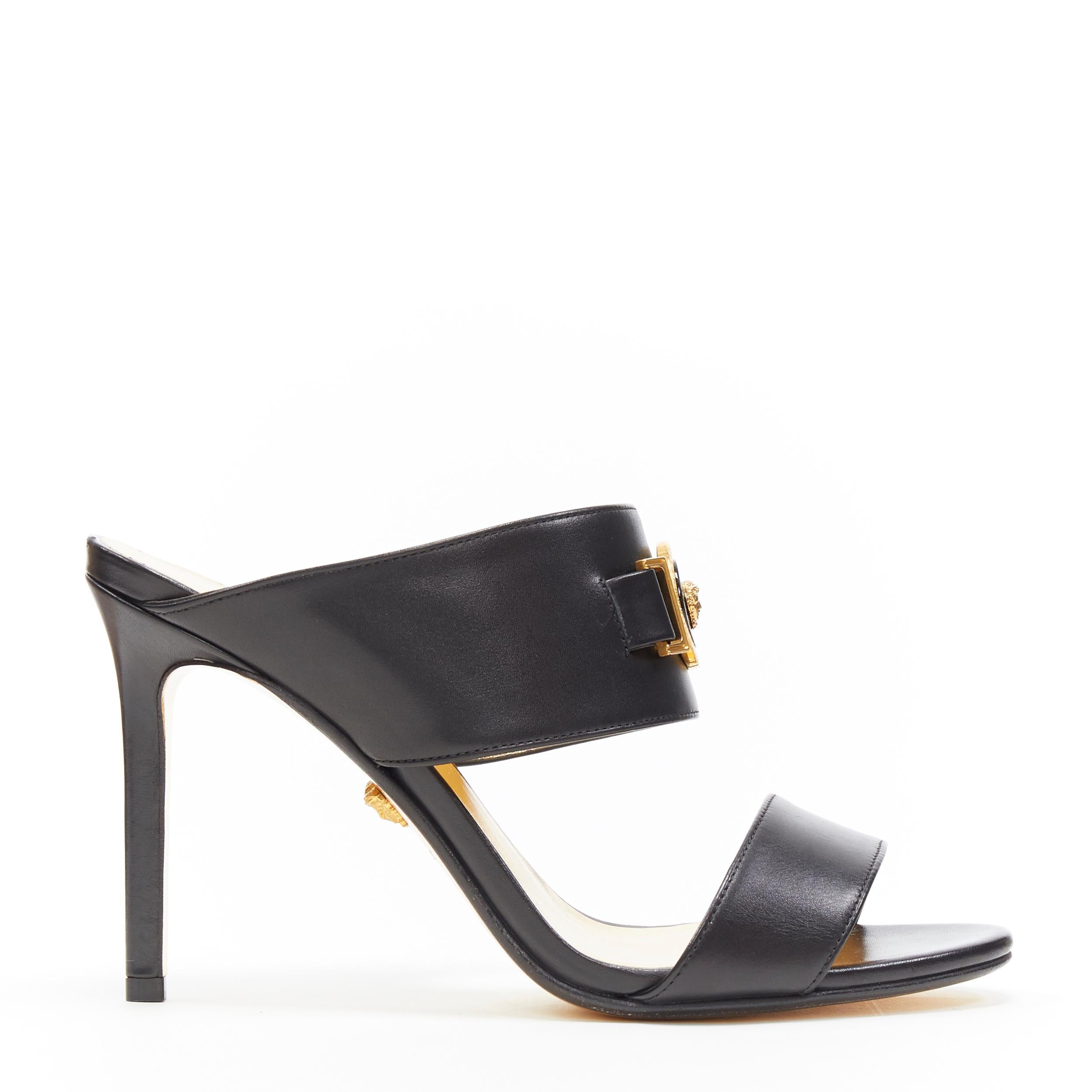 new VERSACE Tribute Medusa Medallion coin dual strap mule high heel sandals EU37
Brand: Versace
Designer: Donatella Versace
Collection: 2019
Model Name / Style: Mule
Material: Leather
Color: Black
Pattern: Solid
Closure: Slip on
Lining material: