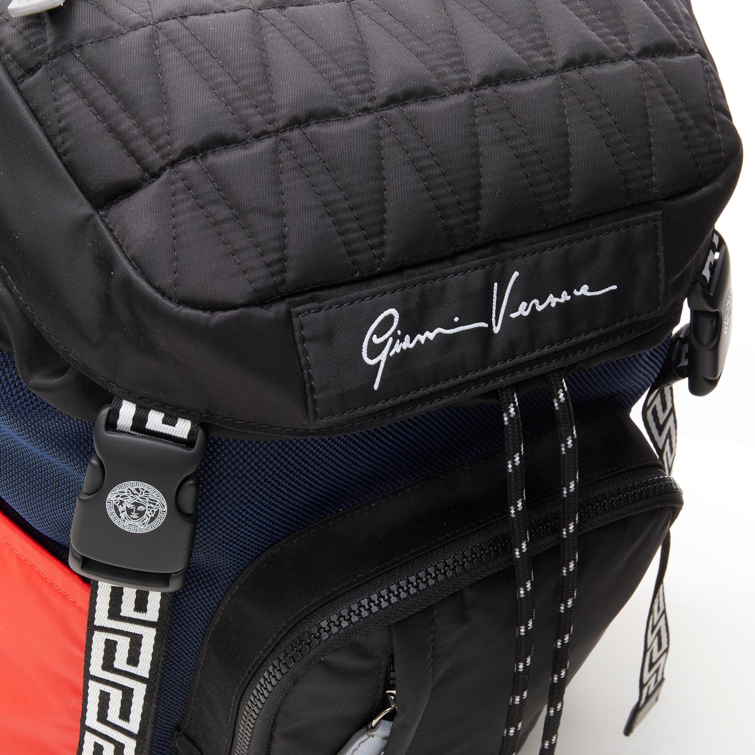 new VERSACE V Code Gianni Signature black red nylon Greca backpack
Reference: TGAS/C00859
Brand: Versace
Designer: Donatella Versace
Model: DFZ8072 DMXTEX K052E
Collection: V Code
Material: Nylon
Color: Black, Red
Pattern: Solid
Closure: