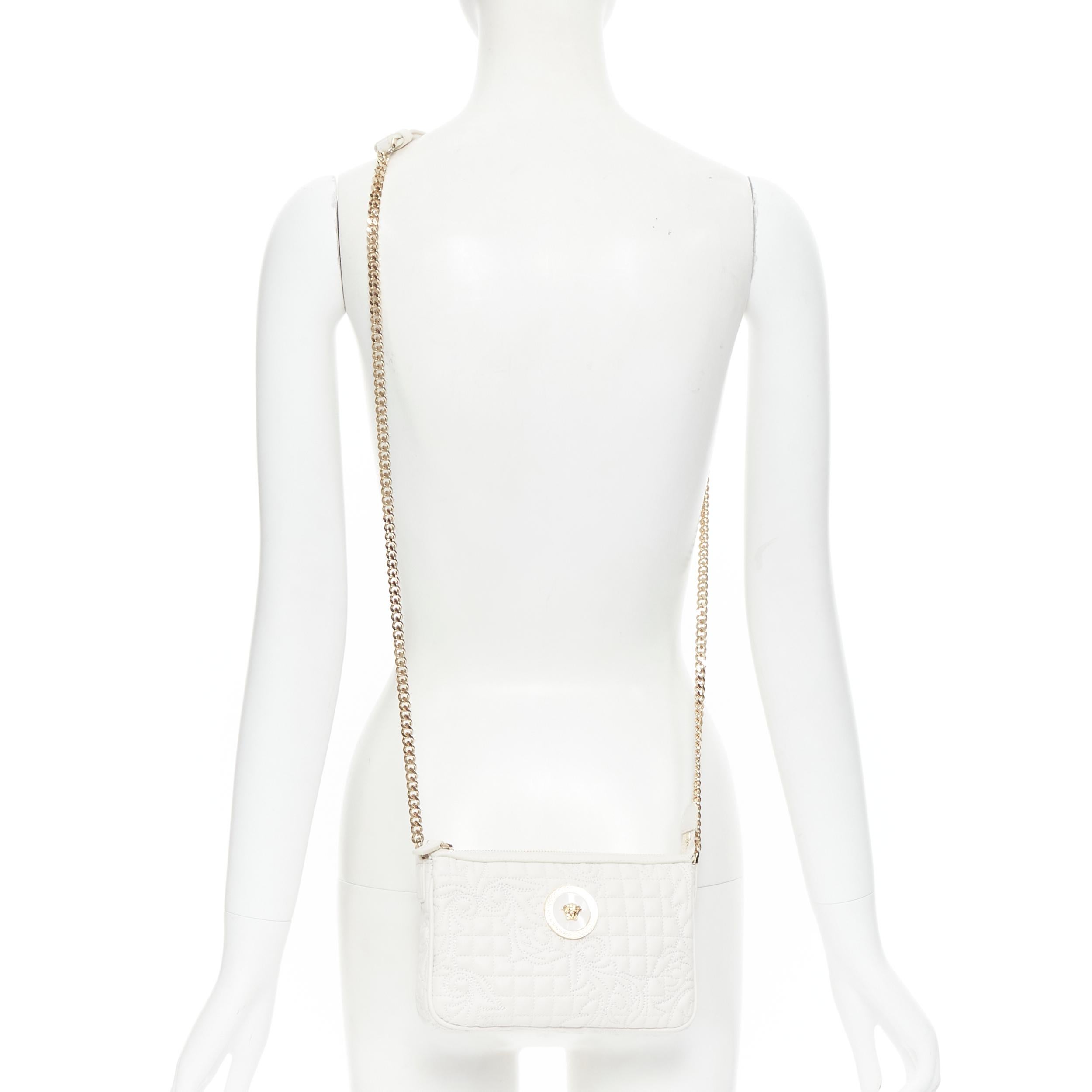 new VERSACE Vanitas white baroque quilted gold Medusa metal chain crossbody bag 
Reference: TGAS/B01474 
Brand: Versace 
Designer: Donatella Versace 
Model: White Vanitas crossbody bag 
Material: Leather 
Color: White 
Pattern: Solid 
Closure: Zip