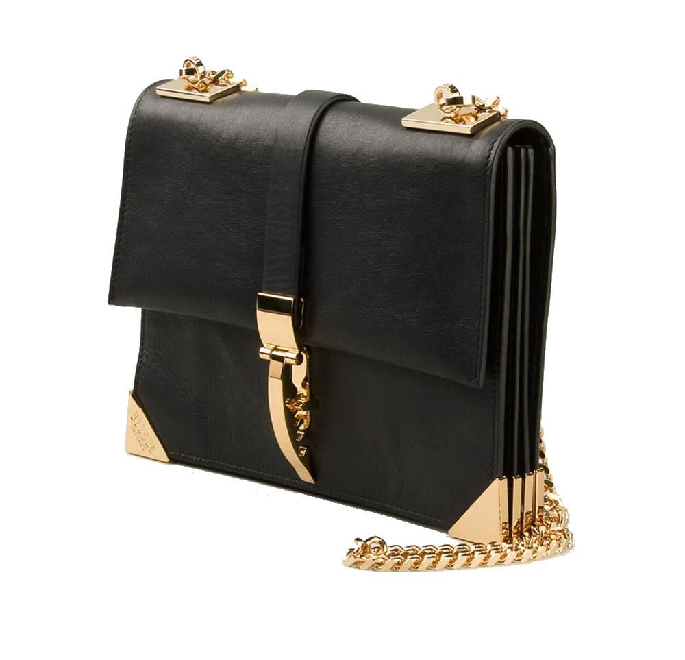 VERSACE 

Versus x Anthony Vaccarello

Shoulder bag in black buffed leather. 

Gold-tone hardware throughout. 

Top foldover flap closure with adjustable stylized hook fastening. 

Plaited chain shoulder strap at top. 

Expandable accordion-fold