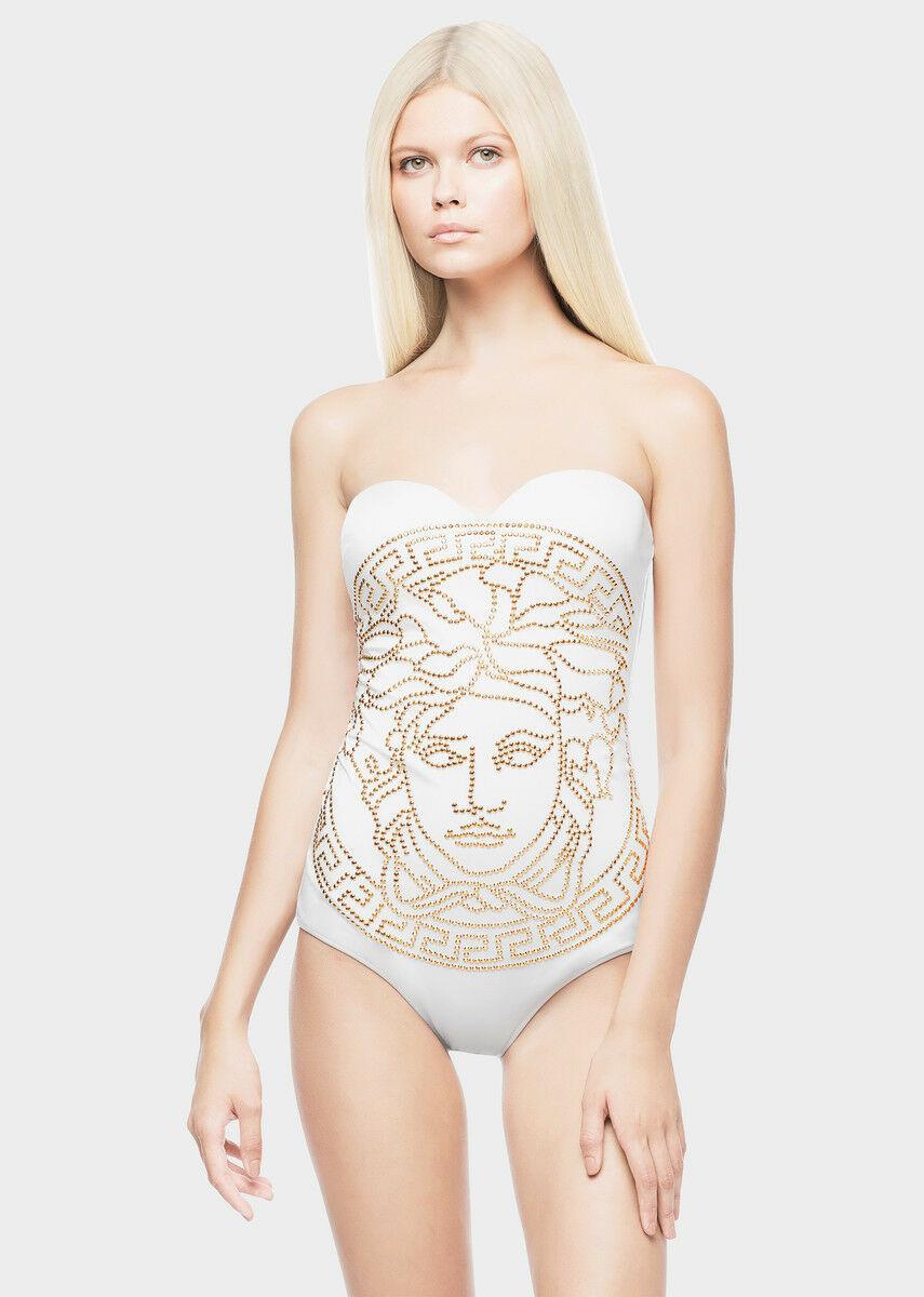 Brand new VERSACE swimsuit

White one piece swimsuit featuring iconic Medusa.

Gold studs

Molded underwire cups. Optional straps. Mesh lining.

85% polyamide/15% elastane.

Made in Italy

Italian Size 2 ( US S)

New, with tags.
 