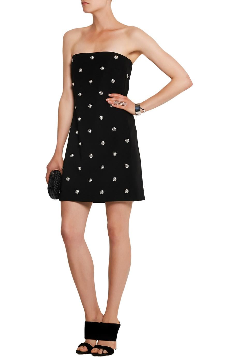 VERSACE VERSUS
+ Anthony Vaccarello 

Studded crepe mini dress

For a seductive LBD that packs a punch, turn to Versus Versace. 

This strapless crepe dress comes with a supportive internal boned corset, 
and is accented with  logo-engraved