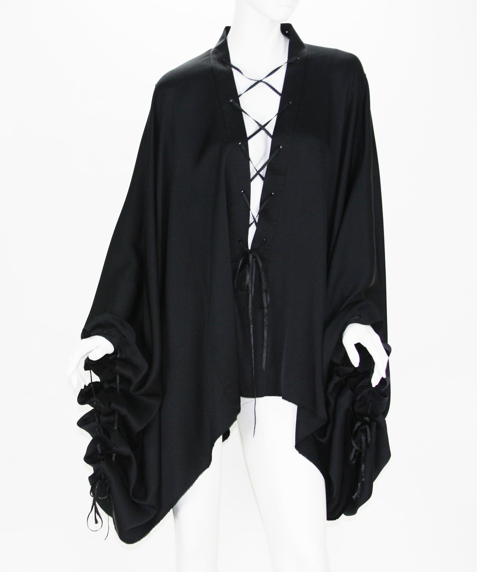 Very Rare Tom Ford for Gucci Silk Black Lace-Up Kimono Top
F/W 2002 Runway Collection
Designer size - 40 ( will fit most because of style )
100% Silk, Deep V-Neck Lace-Up Front, Adjustable Sleeve Ties.
Measurements: Length - 29 inches, Armpit to
