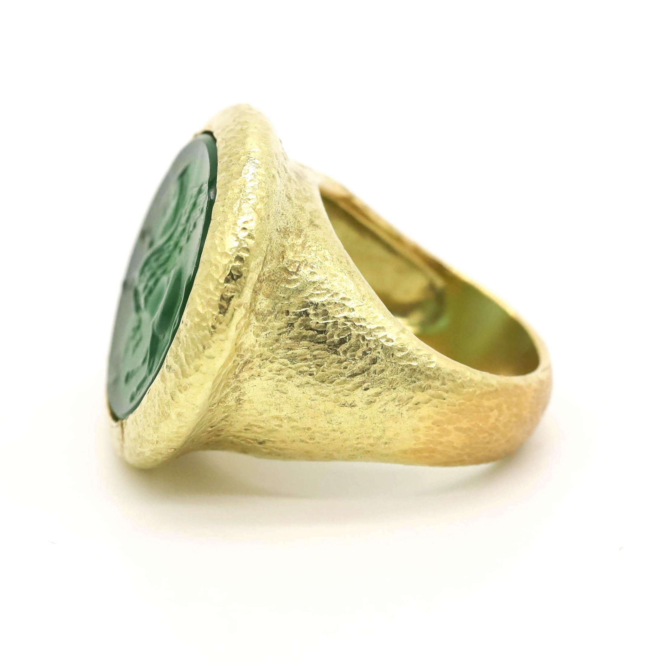 New Victorian Green Italian Murano Glass Carved Intaglio Ring 18k Yellow Gold

The opposite of a cameo, an intaglio is created by carving below the surface to produce an image in relief, with the purpose of pressing into sealing wax. Intaglios were