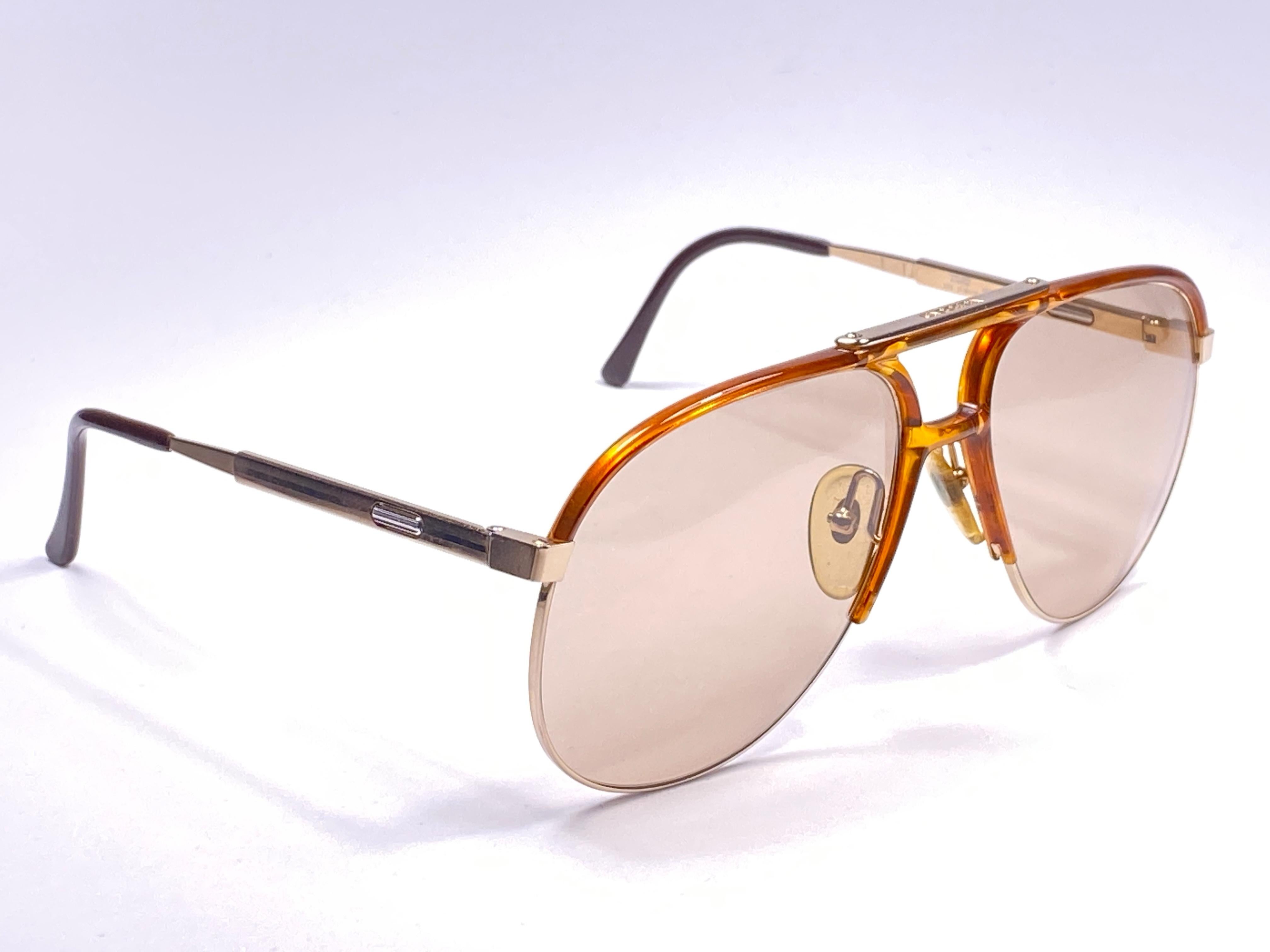 New 1980's Boeing by Carrera Collection aviator silver, gold and acetate details frame with medium brown lenses.   Amazing craftsmanship and quality.   


New, never worn. Made in Austria.

Front : 14 cms

Lens Height : 5.5 cms

Lens Width : 6 cms