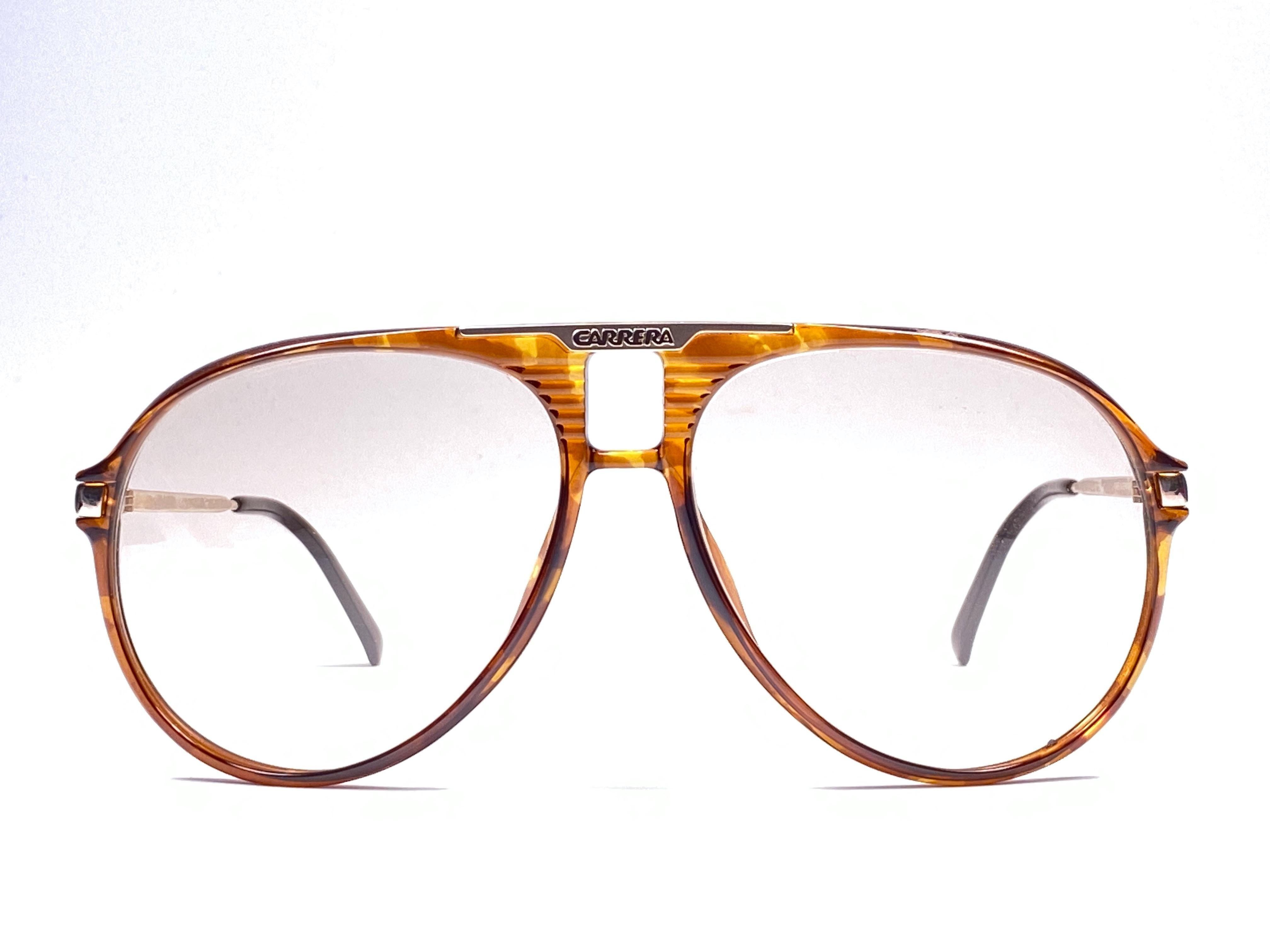 New 1980's Boeing by Carrera Collection aviator gold and tortoise acetate details frame with light brown lenses.   Amazing craftsmanship and quality.   


New, never worn. Made in Austria.

Front : 14 cms

Lens Height : 5.5 cms

Lens Width : 6 cms