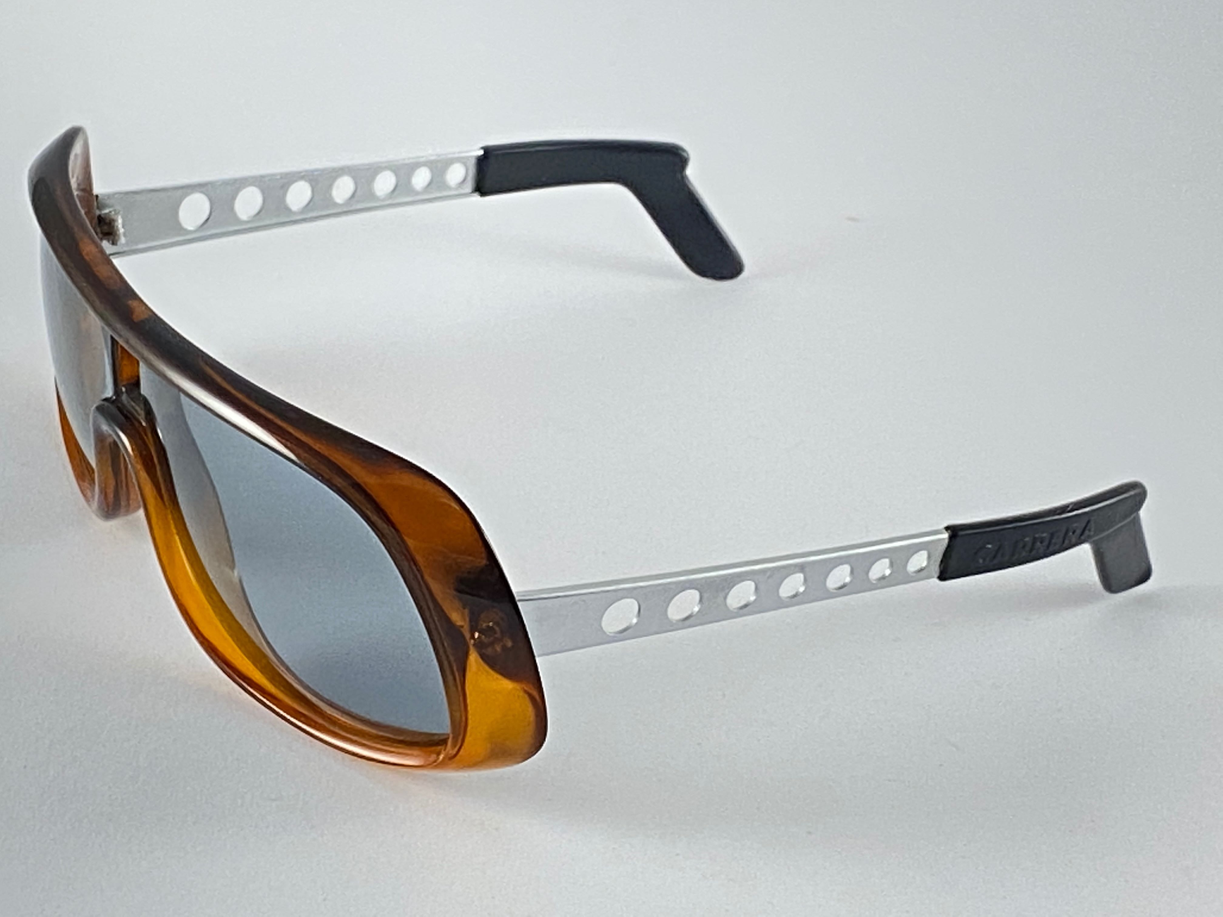 Vintage 1970's Carrera rare oversized frame sporting medium amber lenses. 
Amazing craftsmanship and quality. 

This item is in good vintage condition with light wear. No estructural damages. 

Made in Austria.

FRONT : 14.5 CMS 
LENS HEIGHT : 4.6