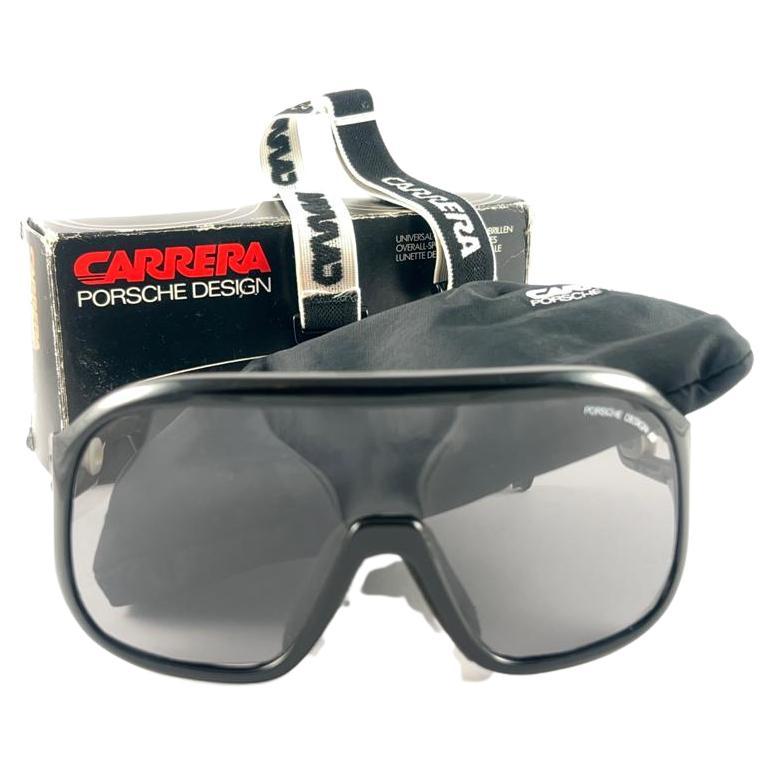 New 1980's Carrera ski oversized frame sporting grey mono lenses lenses. 
Amazing craftsmanship and quality. 

This item has some wear on it due to nearly 40 years of storage. 

Original pouch and elastic sports cord.

New, never worn. Made in