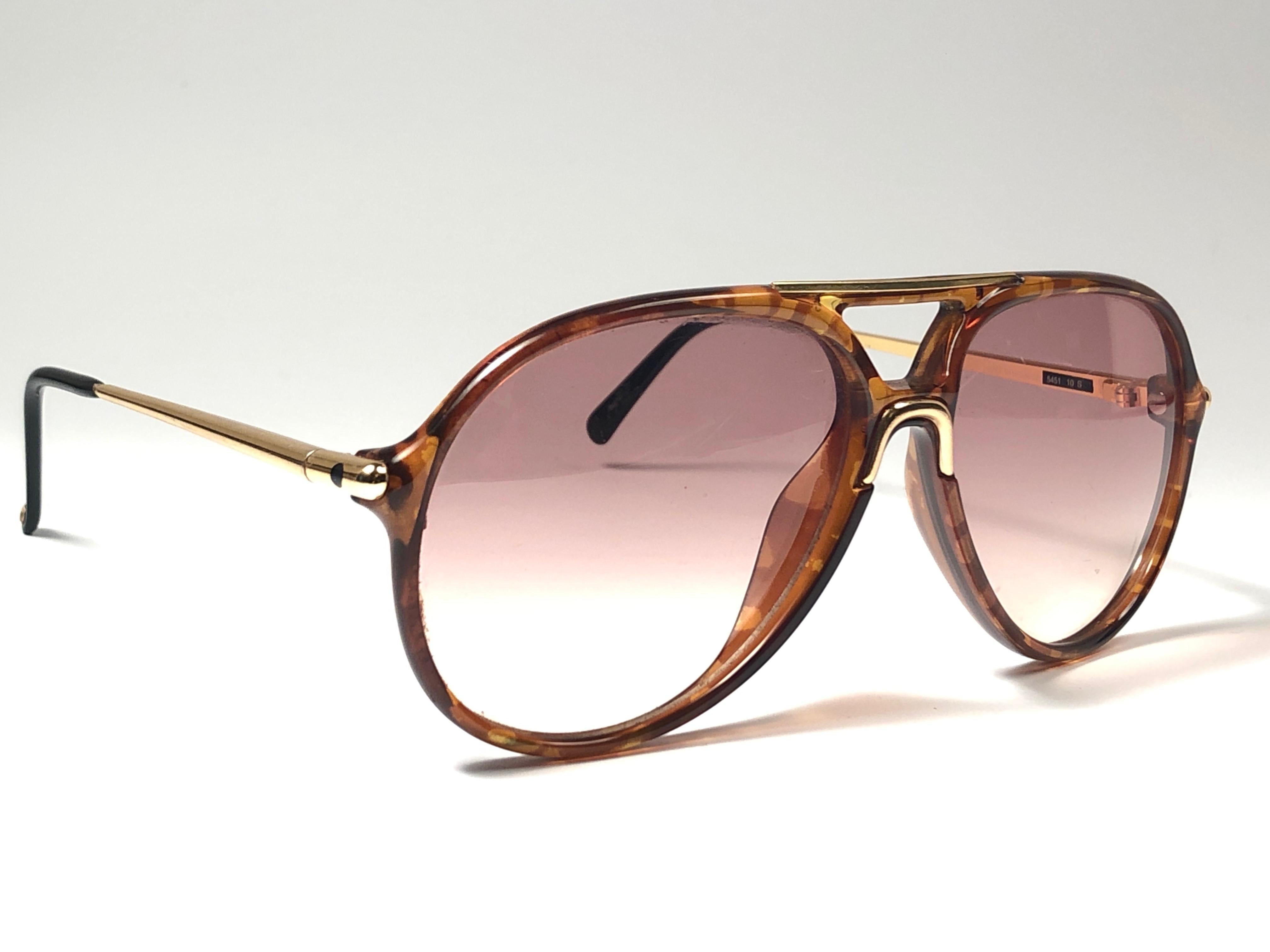 New 1980's Carrera by Movado tortoise frame with brown gradient lenses.  
Amazing craftsmanship and quality.  

This item has some wear on it due to nearly 40 years of storage. 

New, never worn. Made in Austria.