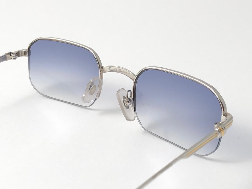 New 1990 Cartier Broadway half frame Vendome 49 [] 22 Sunglasses with blue gradient (uv protection) lenses. All hallmarks. Cartier gold signs on the ear paddles. These are like a pair of jewels on your nose. Please notice that this sunglasses are