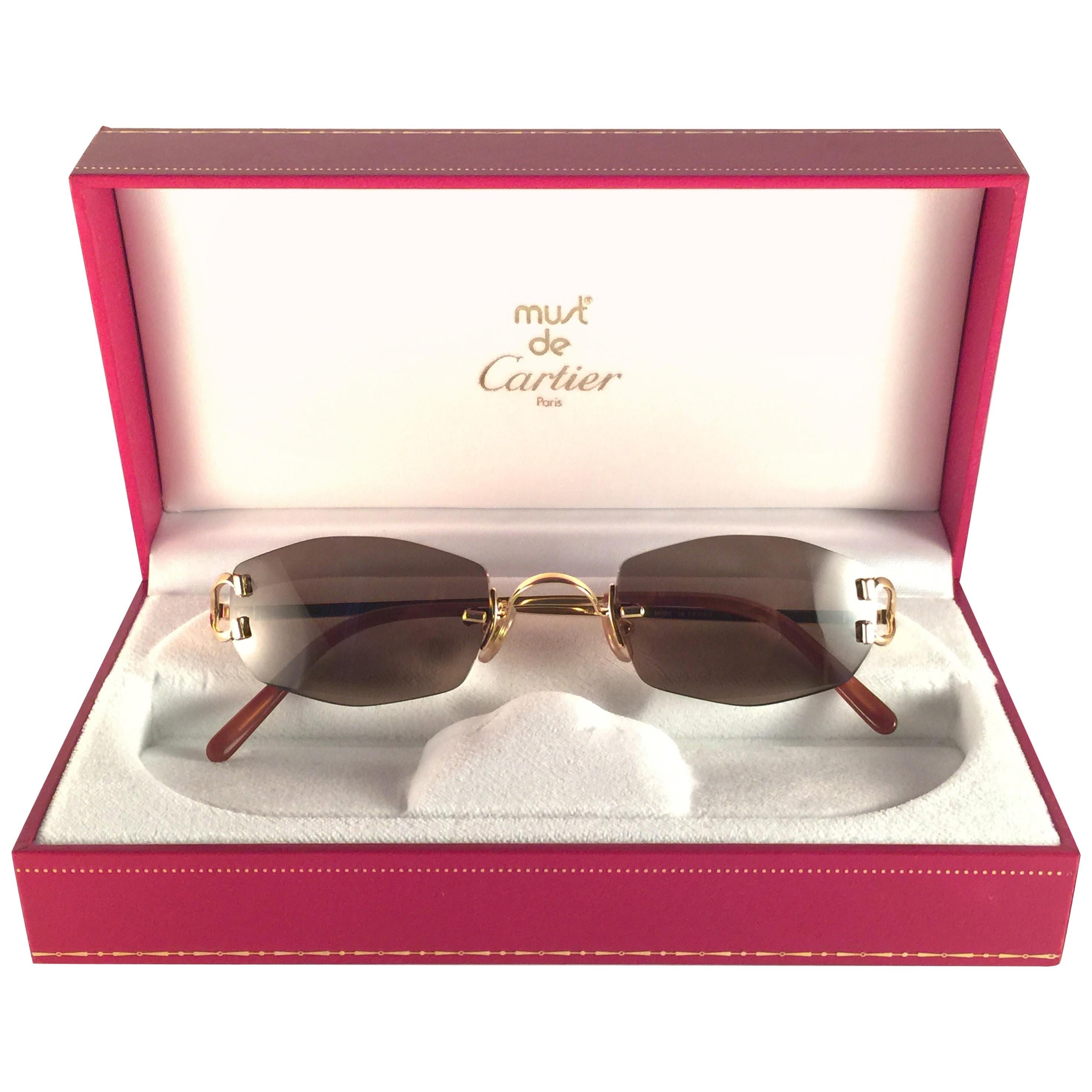 New Vintage Cartier Capri Gold 49mm Rimless Brown Lens France Sunglasses at  1stDibs