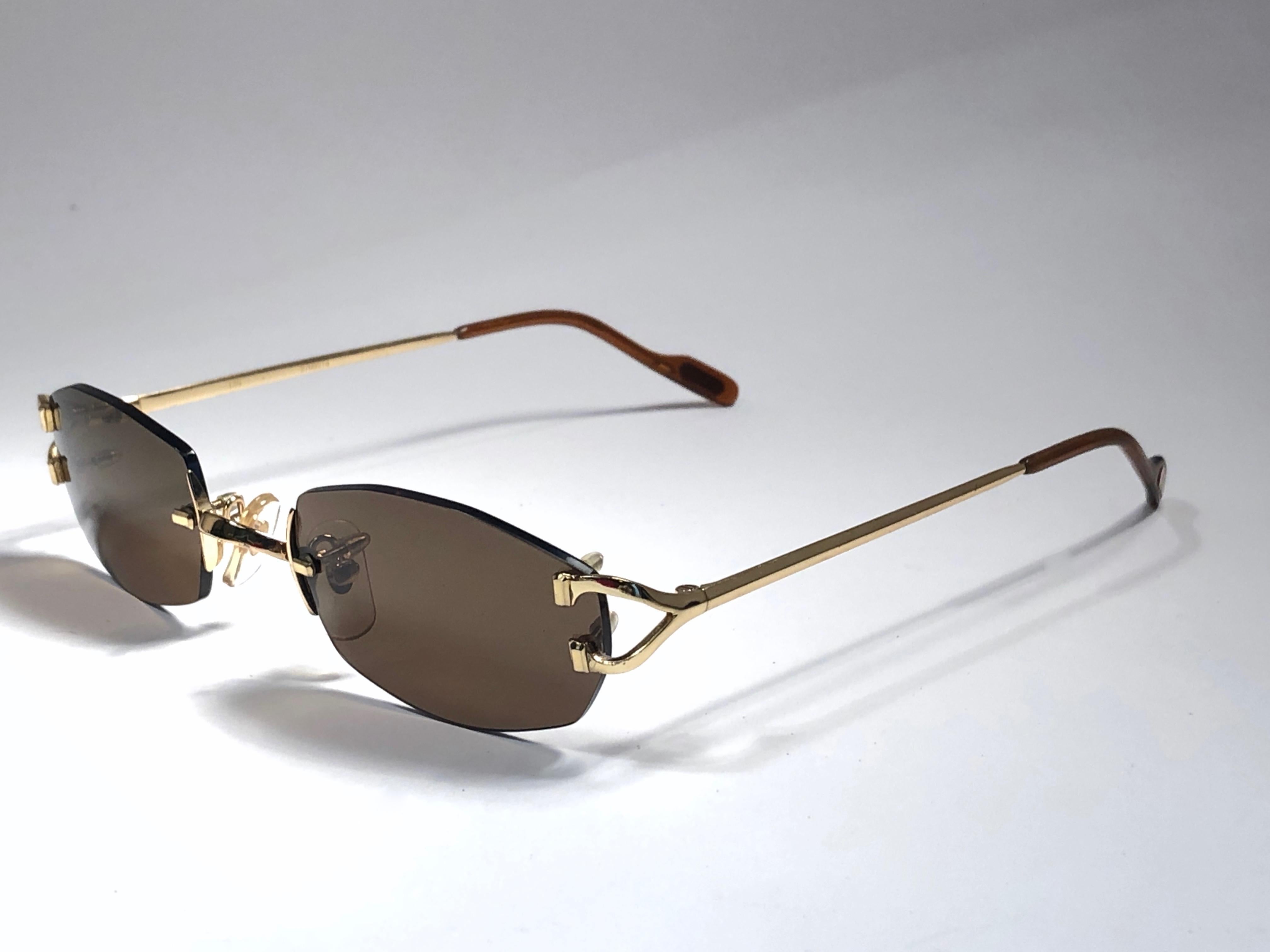 New Vintage Cartier Capri Gold Plated 18K Rimless Brown Lens France Sunglasses In New Condition For Sale In Baleares, Baleares