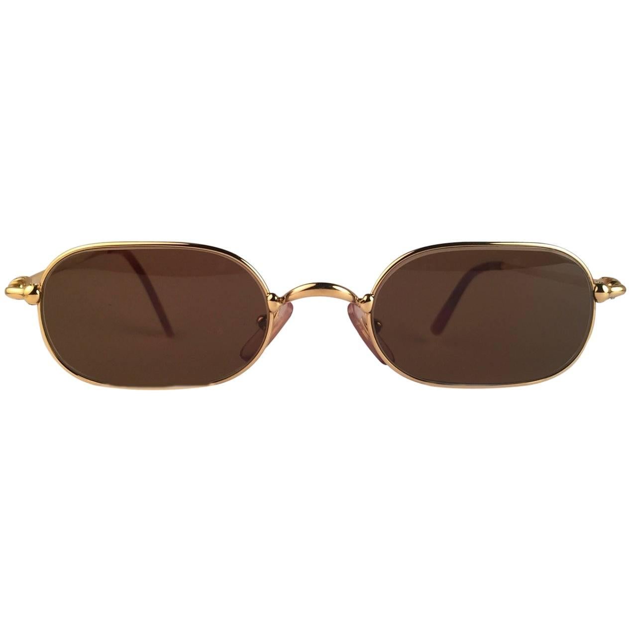 New 1990 Cartier Deimios 50 [] 21 Sunglasses with brown  (uv protection) lenses. 
All hallmarks. Cartier gold signs on the ear paddles. These are like a pair of jewels on your nose. Beautiful design and a real sign of the times. Original Cartier