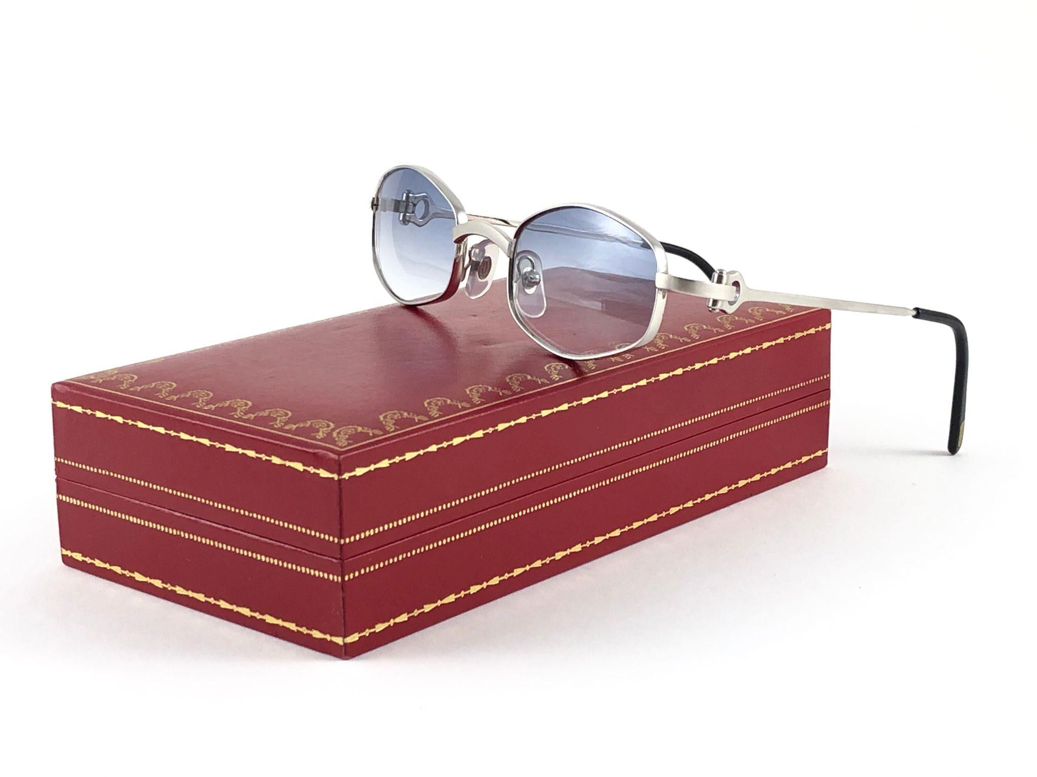 New Cartier Ginger brushed platine plated with light gradient (uv protection) lenses. 
All hallmarks. Cartier silver signs on the earpaddles. These are like a pair of jewels on your nose with the 18k platine plated accents. Beautiful design and a