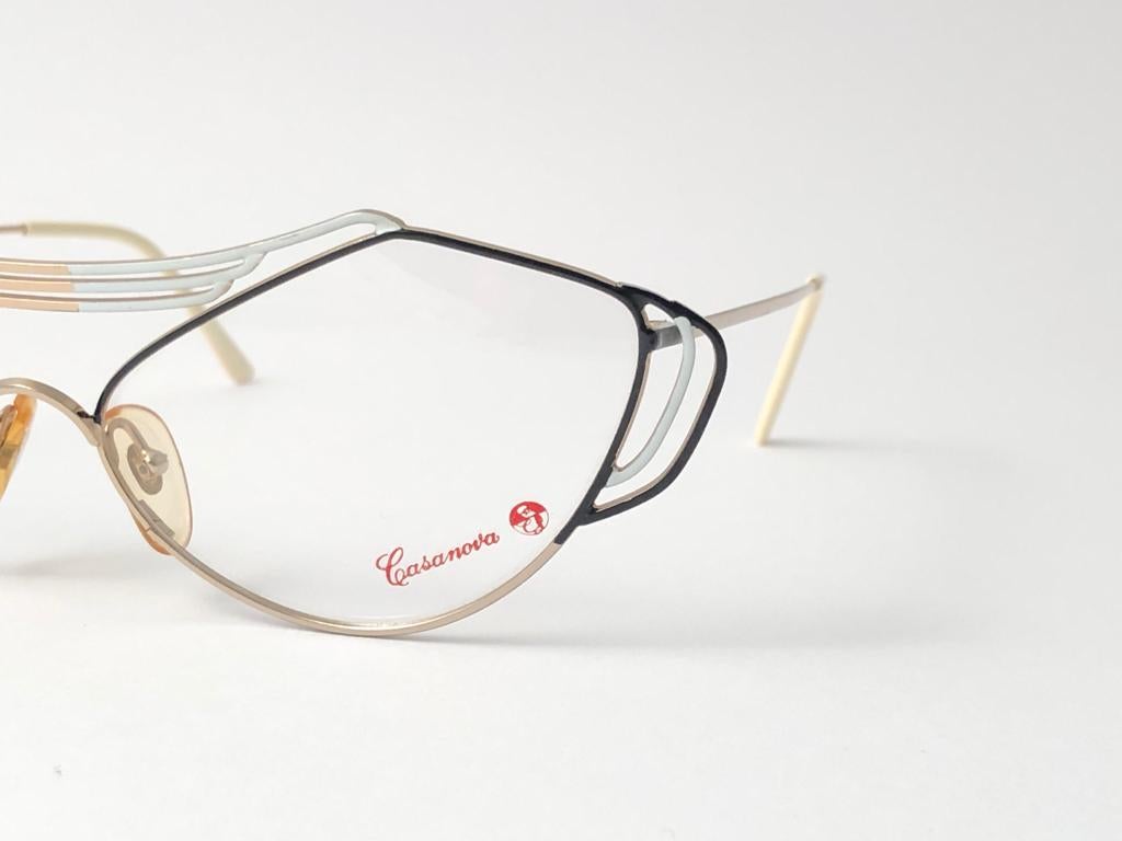 New Vintage Casanova distinctive cat eyed shaped frame with original demo lenses.

This pair may have minor sign of wear due to storage.

Made in Italy.

MEASUREMENTS 


FRONT : 14.5 CMS

LENS HEIGHT : 4.4 CMS

LENS WIDTH : 5.8 CMS

TEMPLES : 12.5