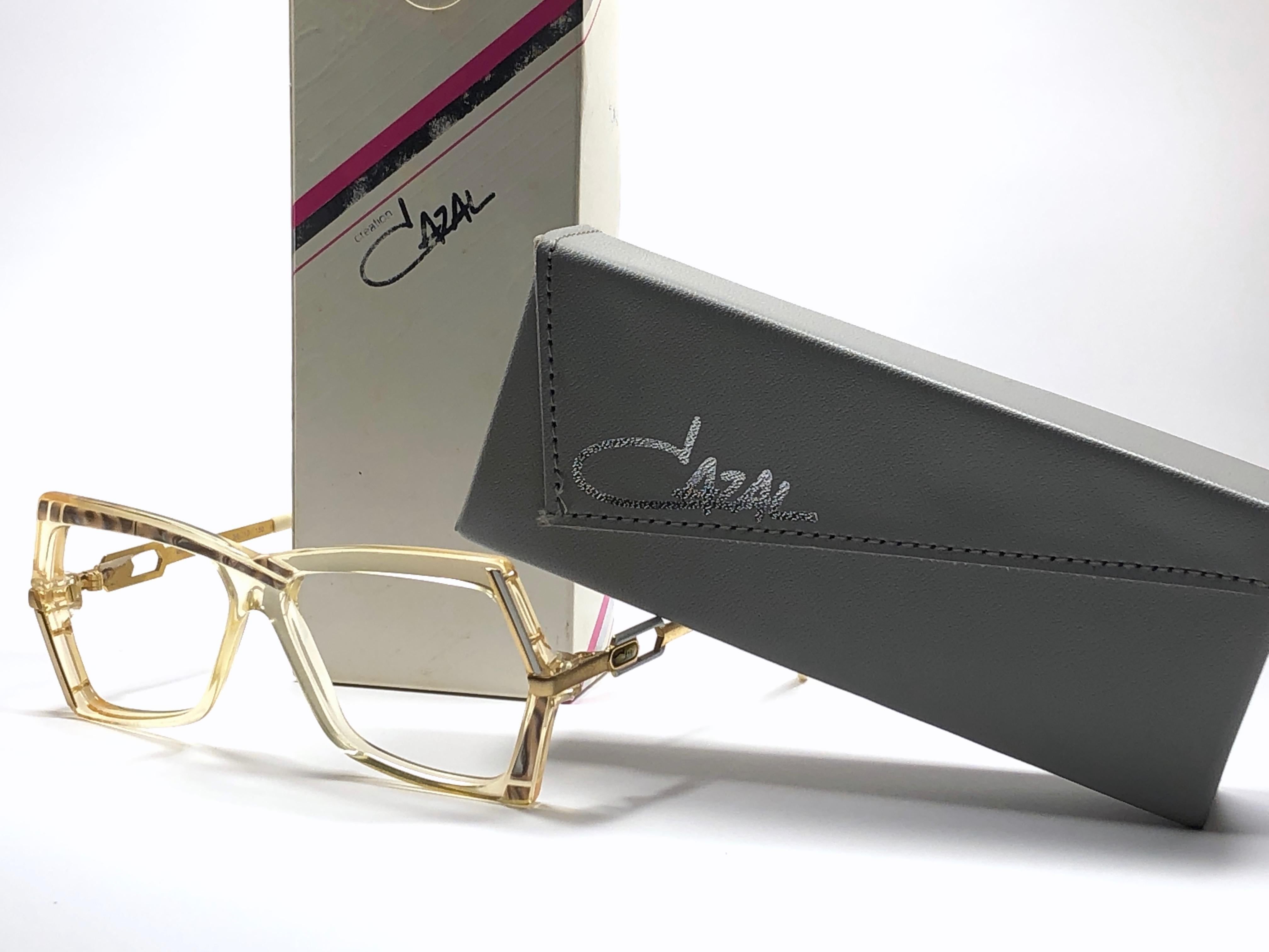 New Vintage Cazal 183 translucent with gold details frame. Perfect for reading spectacles. 

Comes with its original Cazal case. This item may show minor sign of wear due to storage.

Made in West Germany.