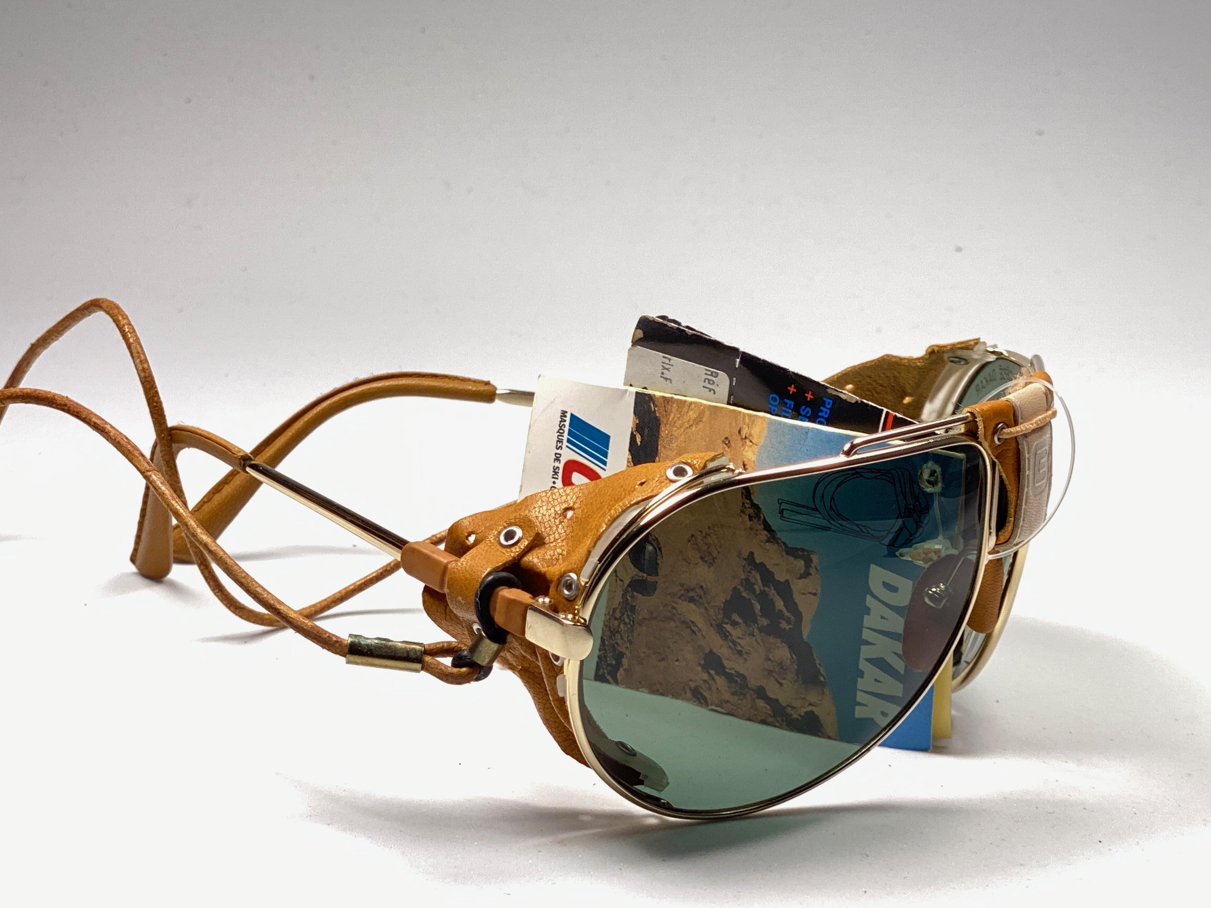 New Vintage Cebe Dakar gold aviator medium size with leather accents on nose bridge, sides and removable cord sunglasses. From the very same series as the ones worn by the great Miles Davis.

Sturdy and cool frame sporting a pair of RB3 green