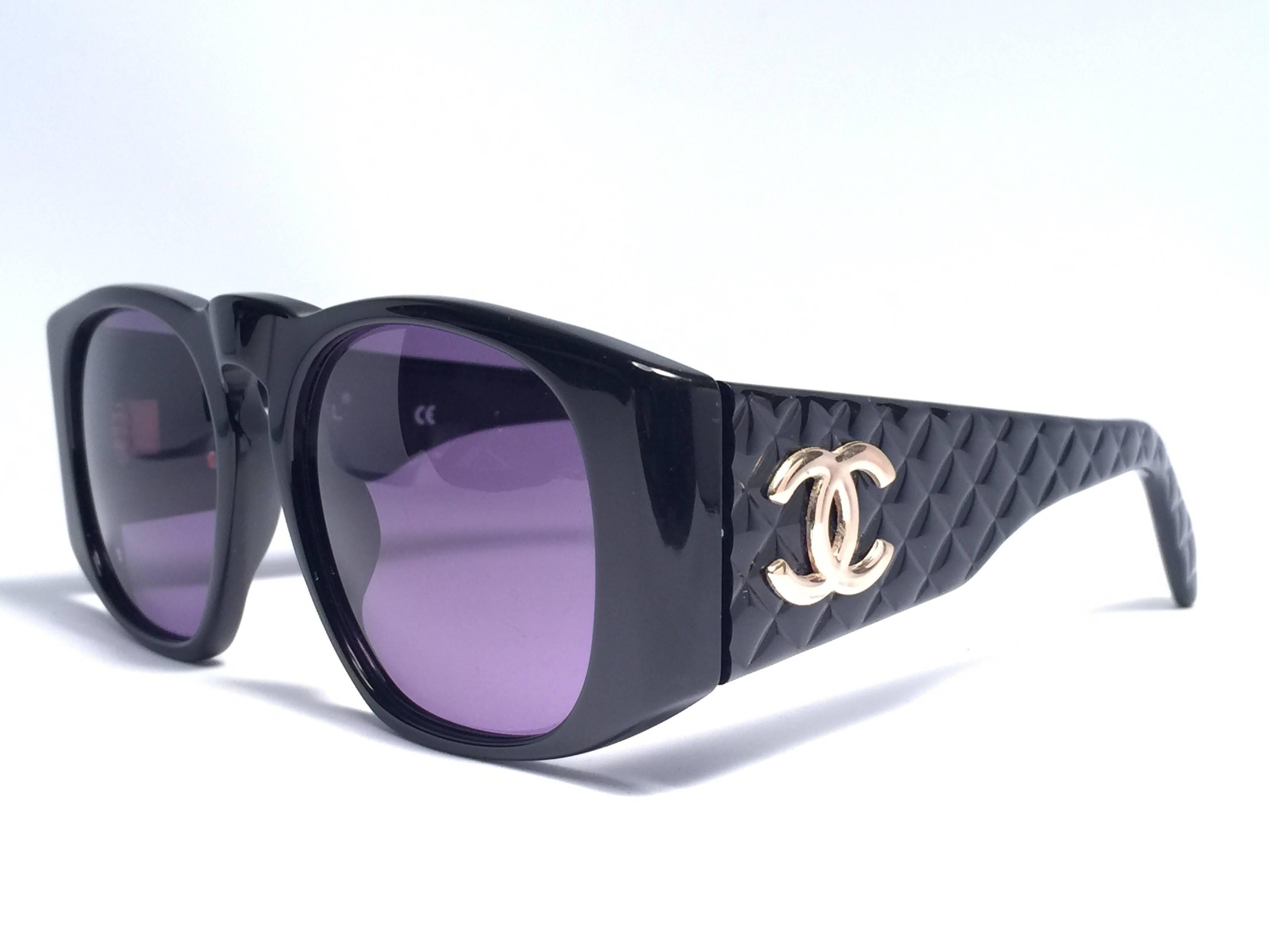 New Vintage Chanel Black quilted sunglasses with spotless smoke grey lenses for a total incognito look.

New, never worn or displayed, this pair of Chanel sunglasses is an absolute showstopper.