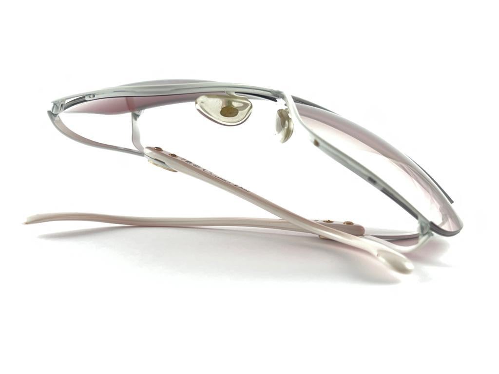  Highly coveted Christian Dior butterly in polar white.
Spotless gradient lenses. 
A collector’s piece!  
New, never worn or displayed. This item may show minor sign of wear due to storage.
Made in Austria. 

FRONT : 12.5 CMS

LENS HEIGHT : 5.3