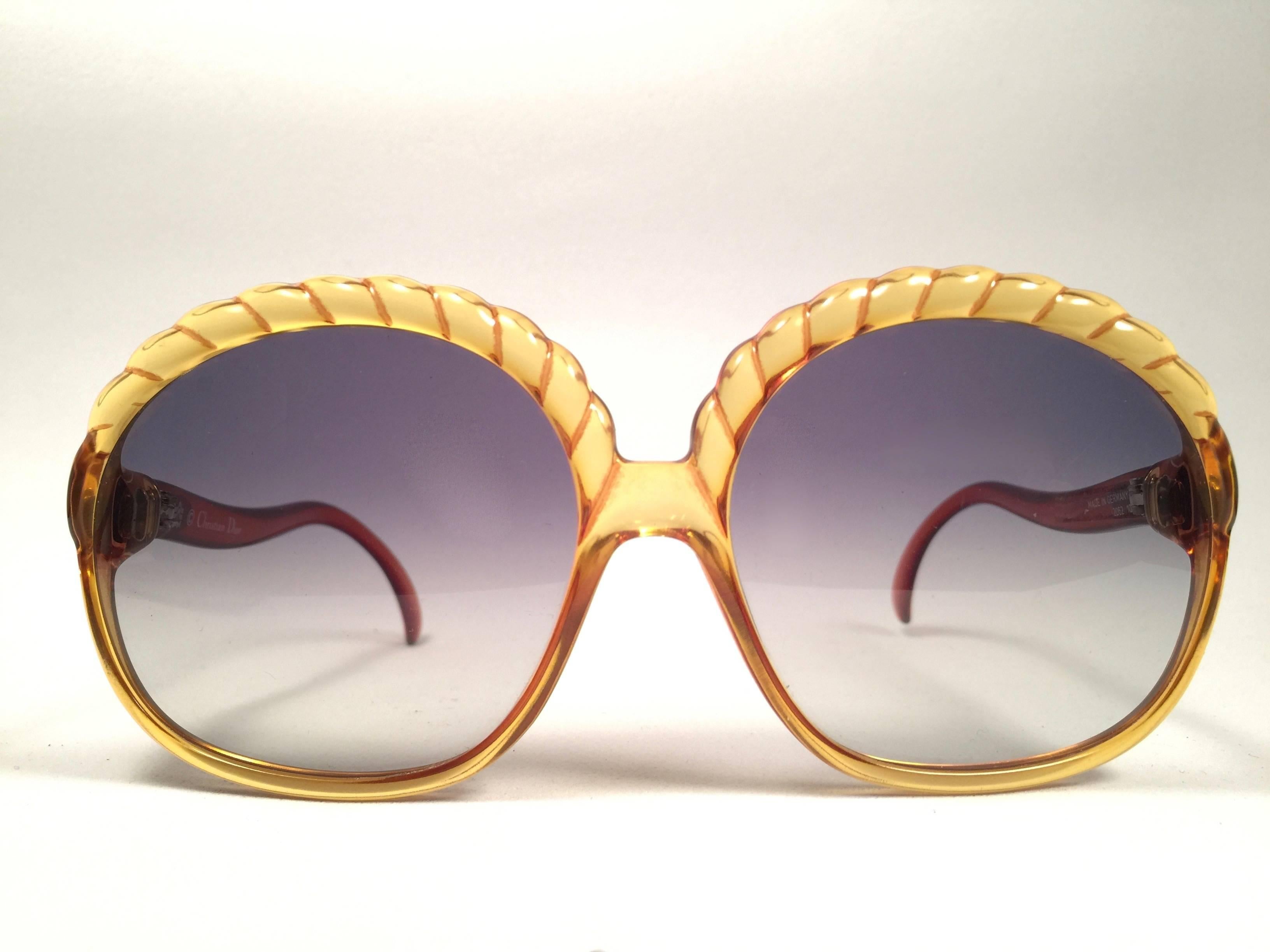 Mint Vintage Christian Dior 2062 Oversized amber translucent 1980's frame with spotless lenses.   
Made in Germany.  

Comes with its original silver Christian Dior Lunettes sleeve.