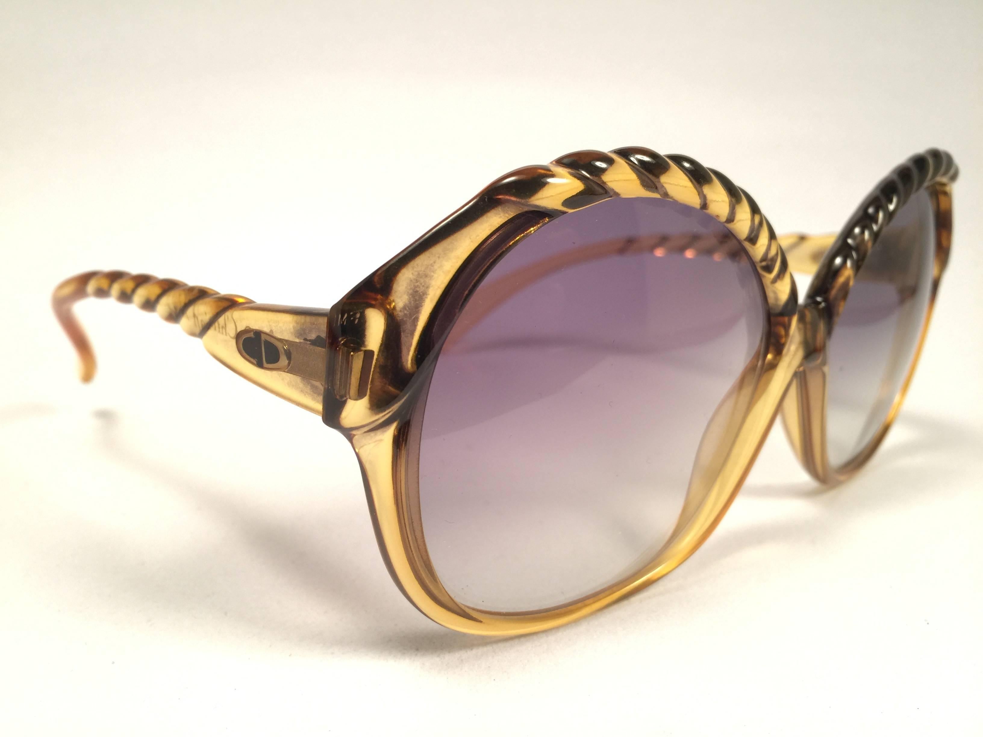 Mint Vintage Christian Dior 2063 20 Oversized translucent 1980's frame with spotless lenses.   
Made in Germany.  

Comes with its original silver Christian Dior Lunettes sleeve.