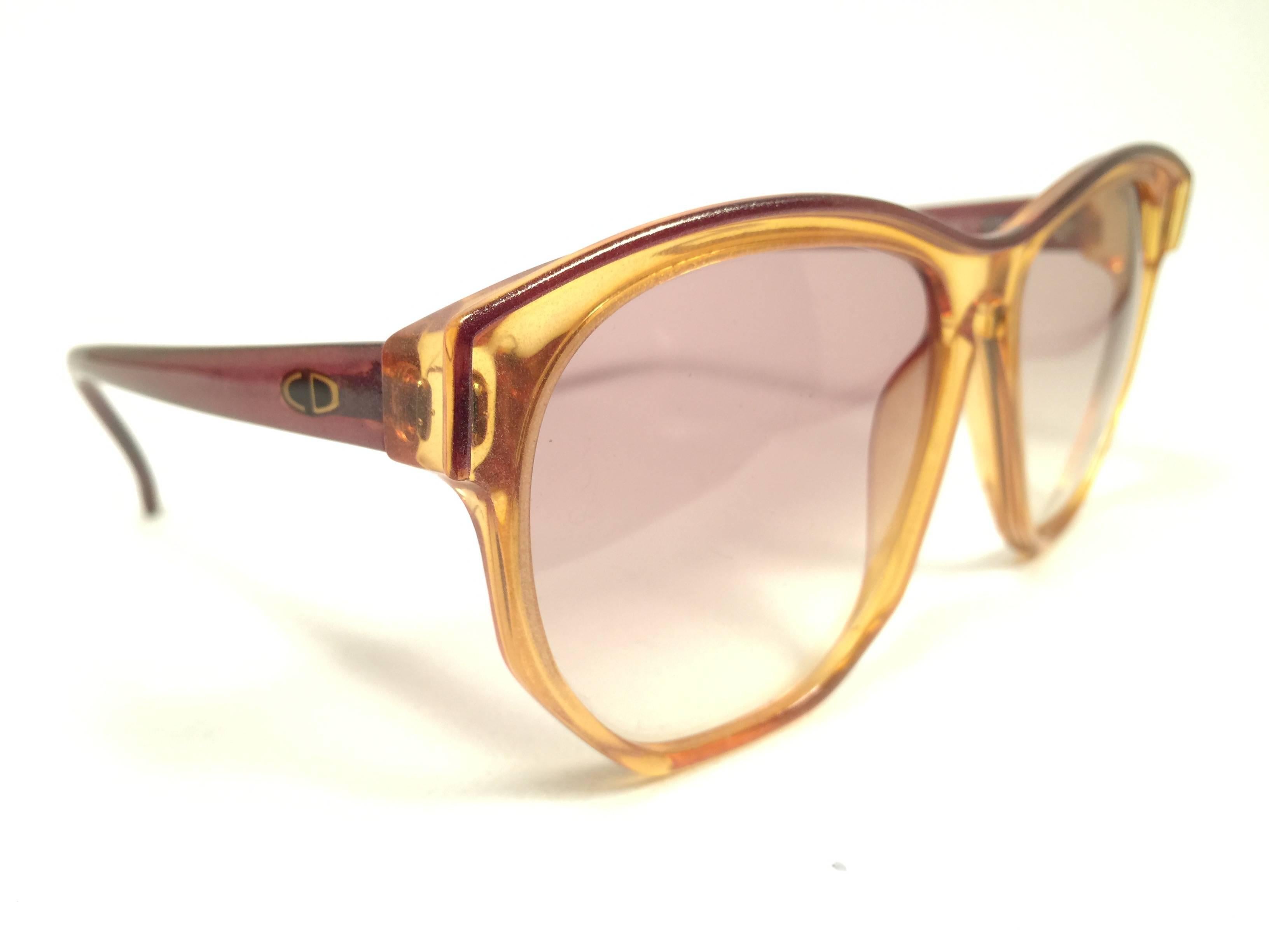 Mint Vintage Christian Dior 2093 Oversized amber translucent 1980's frame with spotless lenses.   
Made in Germany.  

Comes with its original silver Christian Dior Lunettes sleeve.