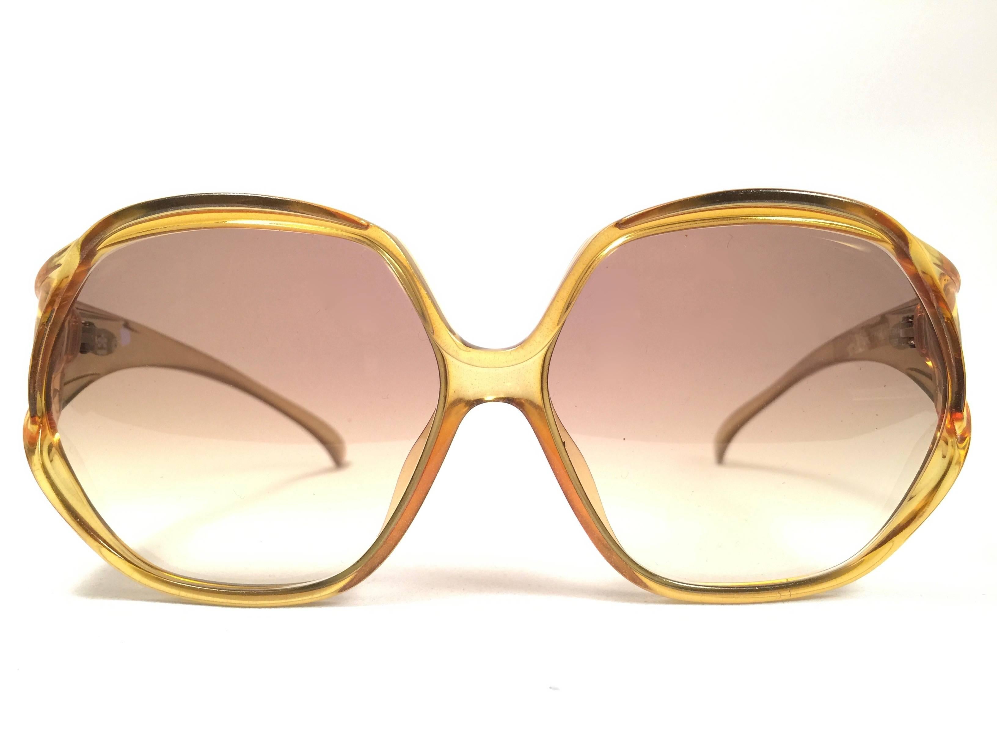 Mint Vintage Christian Dior 2097 50 Oversized amber translucent 1980's frame with spotless lenses.   
Made in Germany.  

Comes with its original silver Christian Dior Lunettes sleeve.