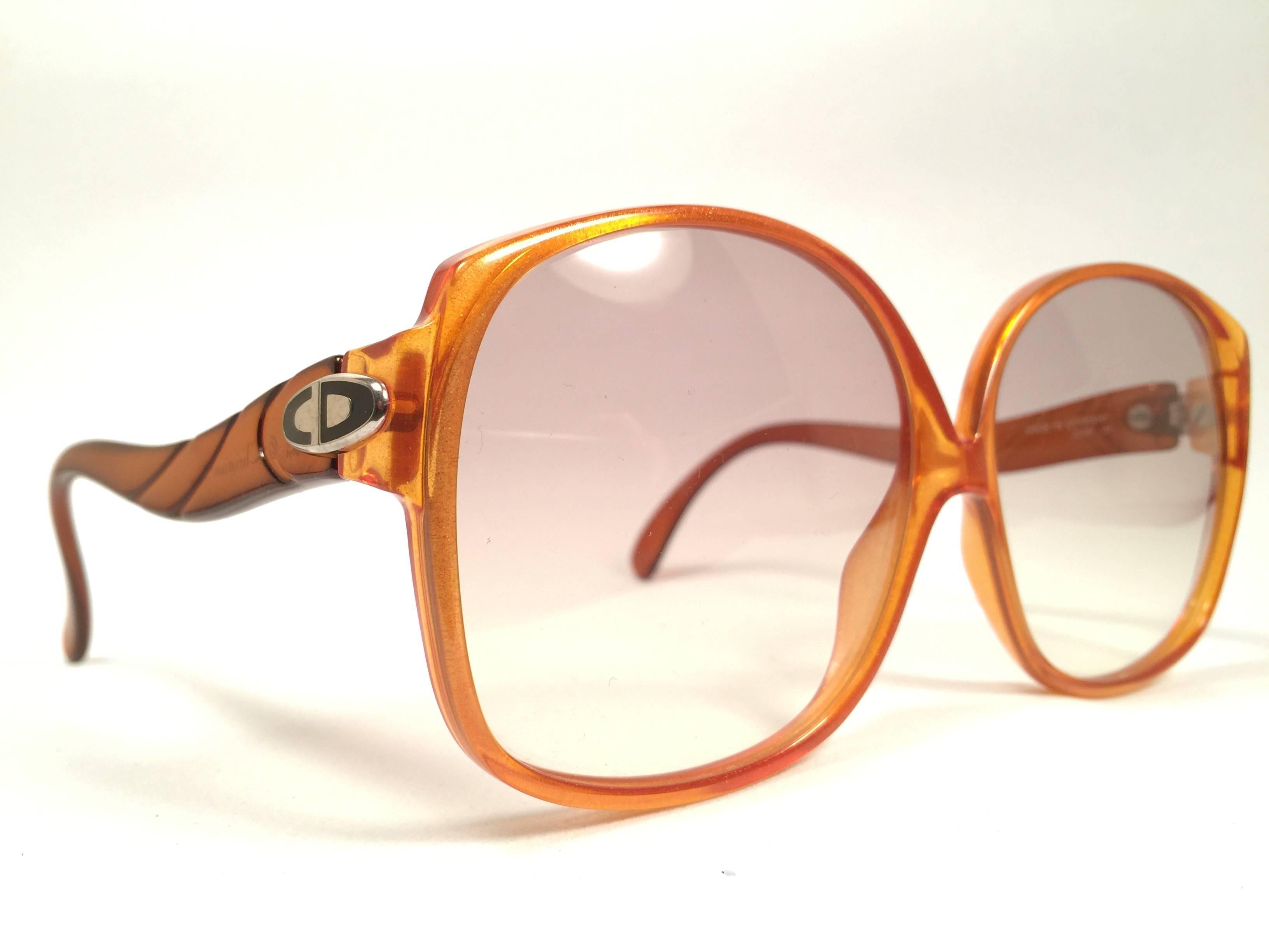 Mint Vintage Christian Dior 2098 Oversized amber translucent 1980's frame with spotless lenses.   
Made in Germany.  

Comes with its original silver Christian Dior Lunettes sleeve.