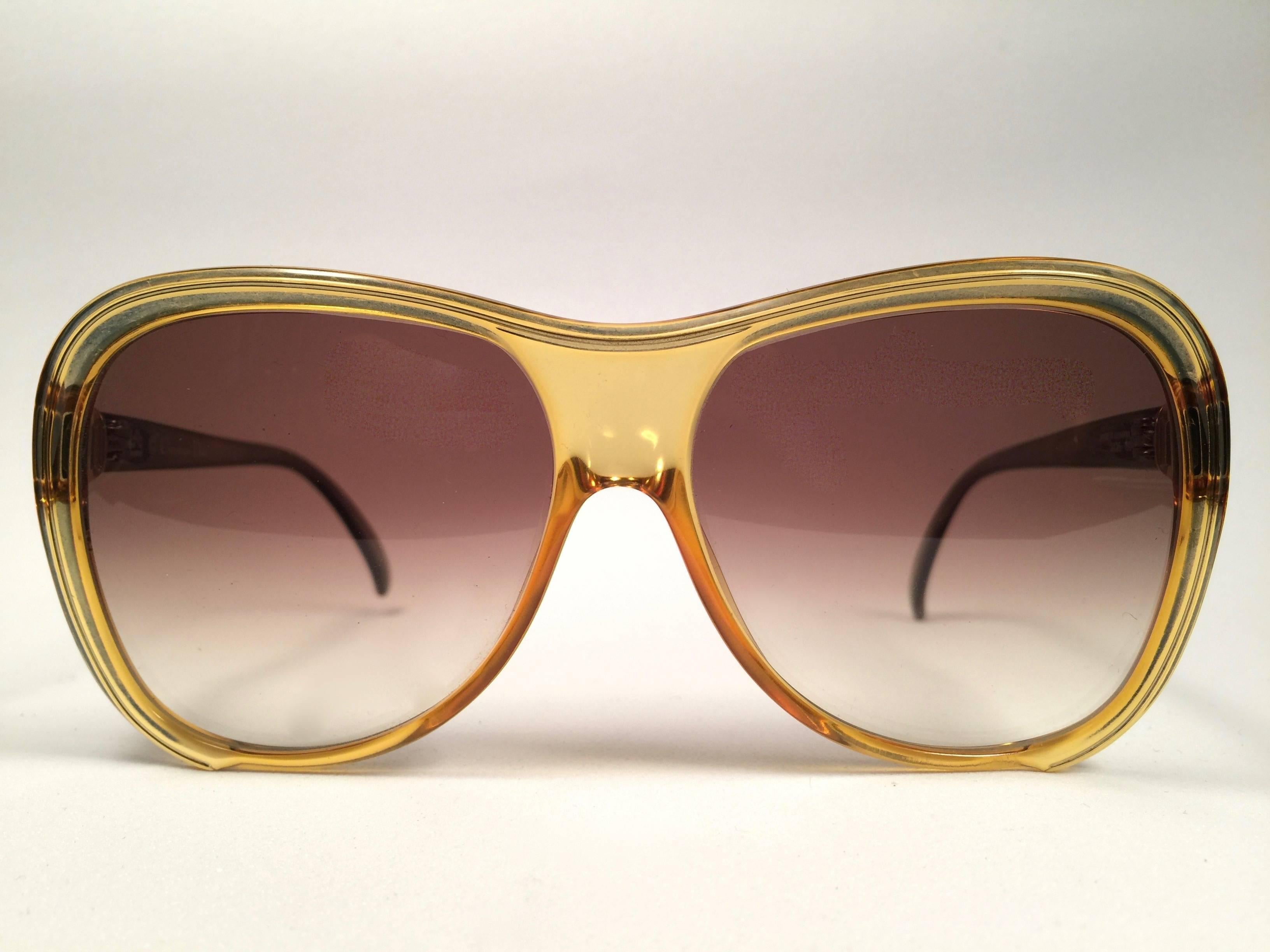 Mint Vintage Christian Dior 2125 Oversized translucent 1980's frame with spotless lenses.   
Made in Germany.  

Comes with its original silver Christian Dior Lunettes sleeve.