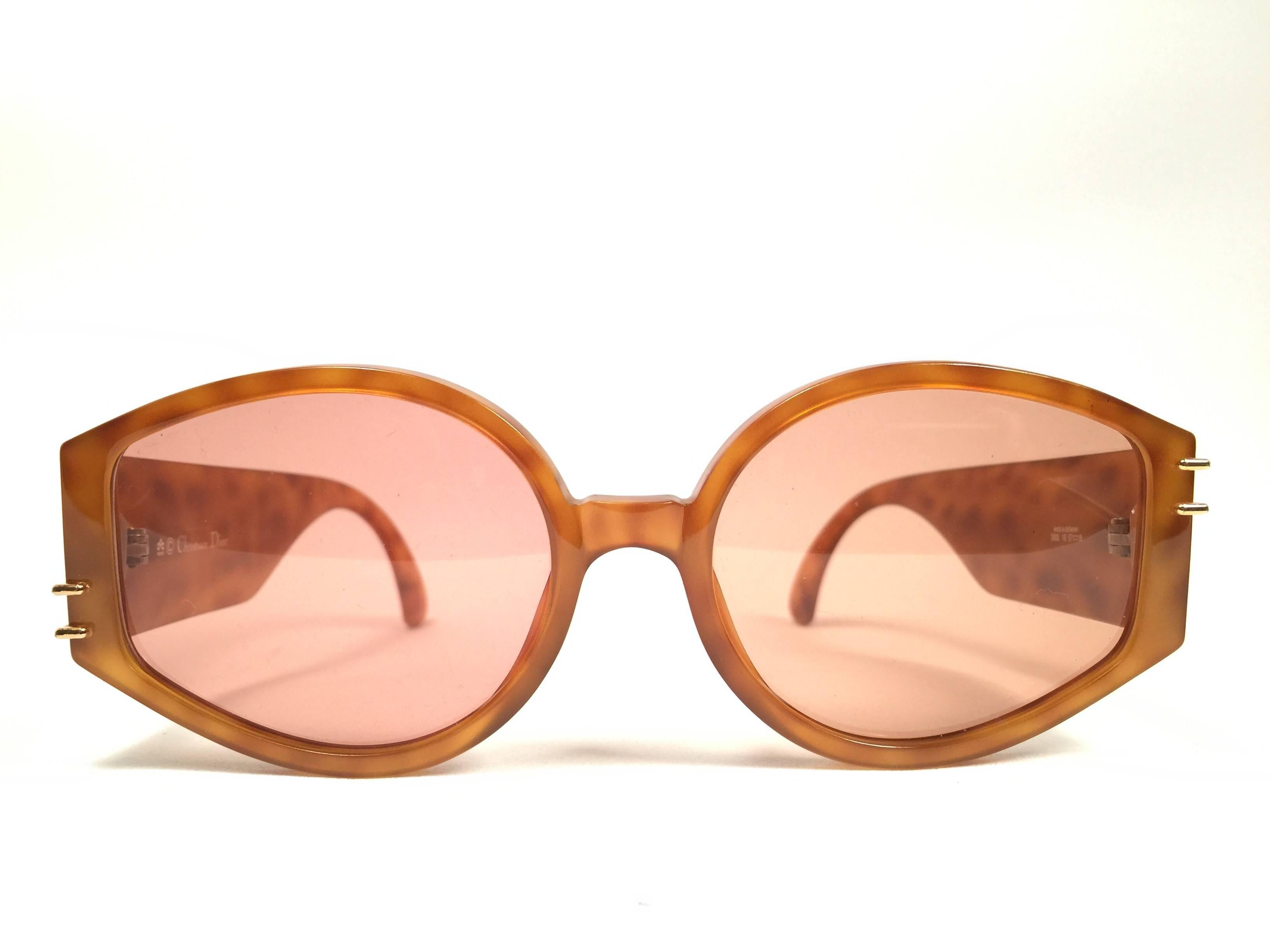 Mint Vintage Christian Dior 2603 translucent honey with gold details 1980's frame with spotless lenses.   
Made in Germany.  

Comes with its original silver Christian Dior Lunettes sleeve.