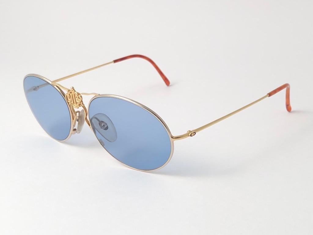 
 
Highly coveted and Iconic Christian Dior Silver & Gold frame.
Holding a light Blue lenses that completes a Great look.
This item may show minor sign of wear due to storage.
 
New, never worn or displayed. Made in Austria.

Front 13 cms
Lens
