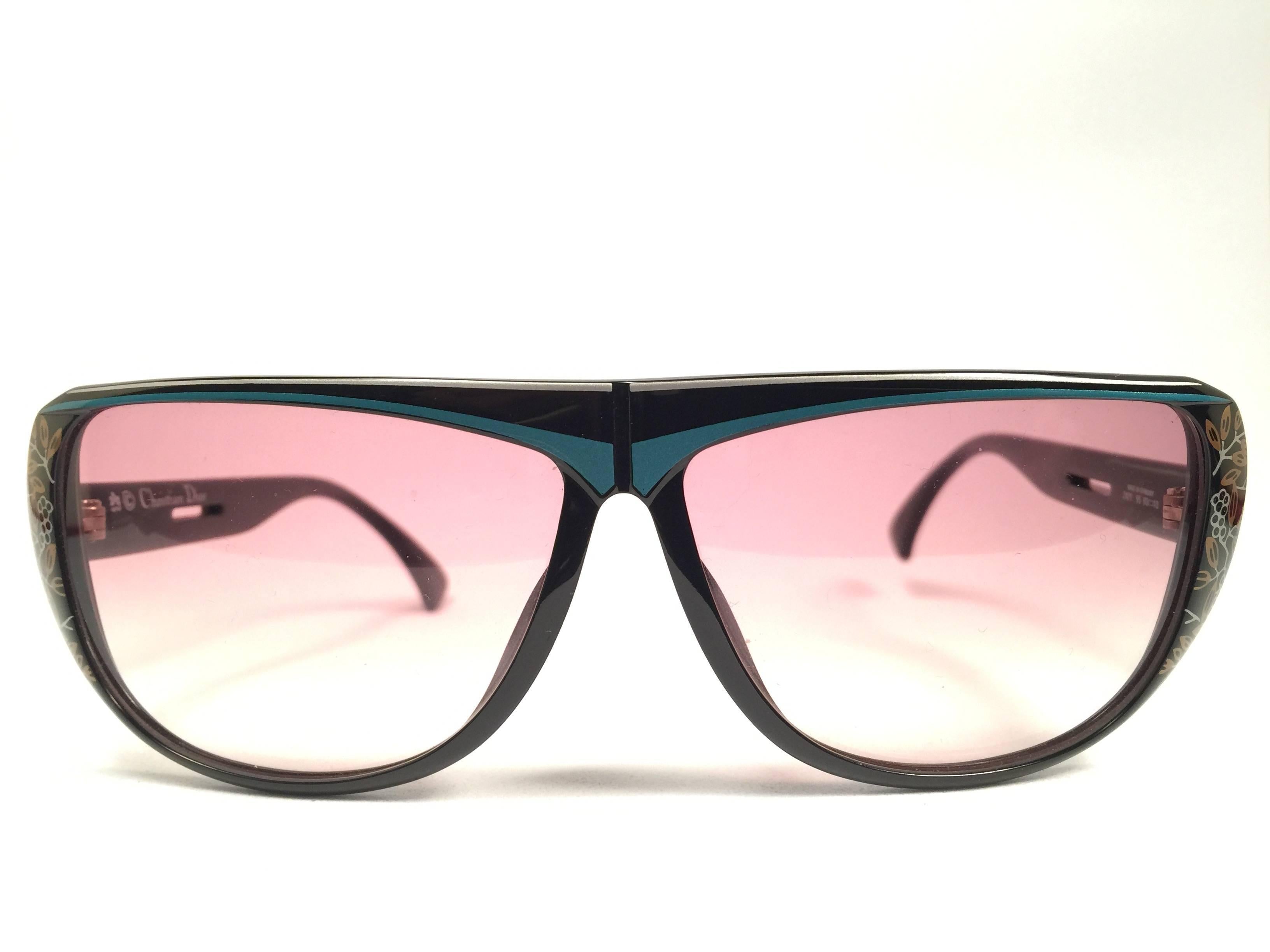 Mint Vintage Christian Dior 2421 black with blue and flower details 1980's frame with spotless lenses.   
Made in Germany.  

Comes with its original silver Christian Dior Lunettes sleeve.